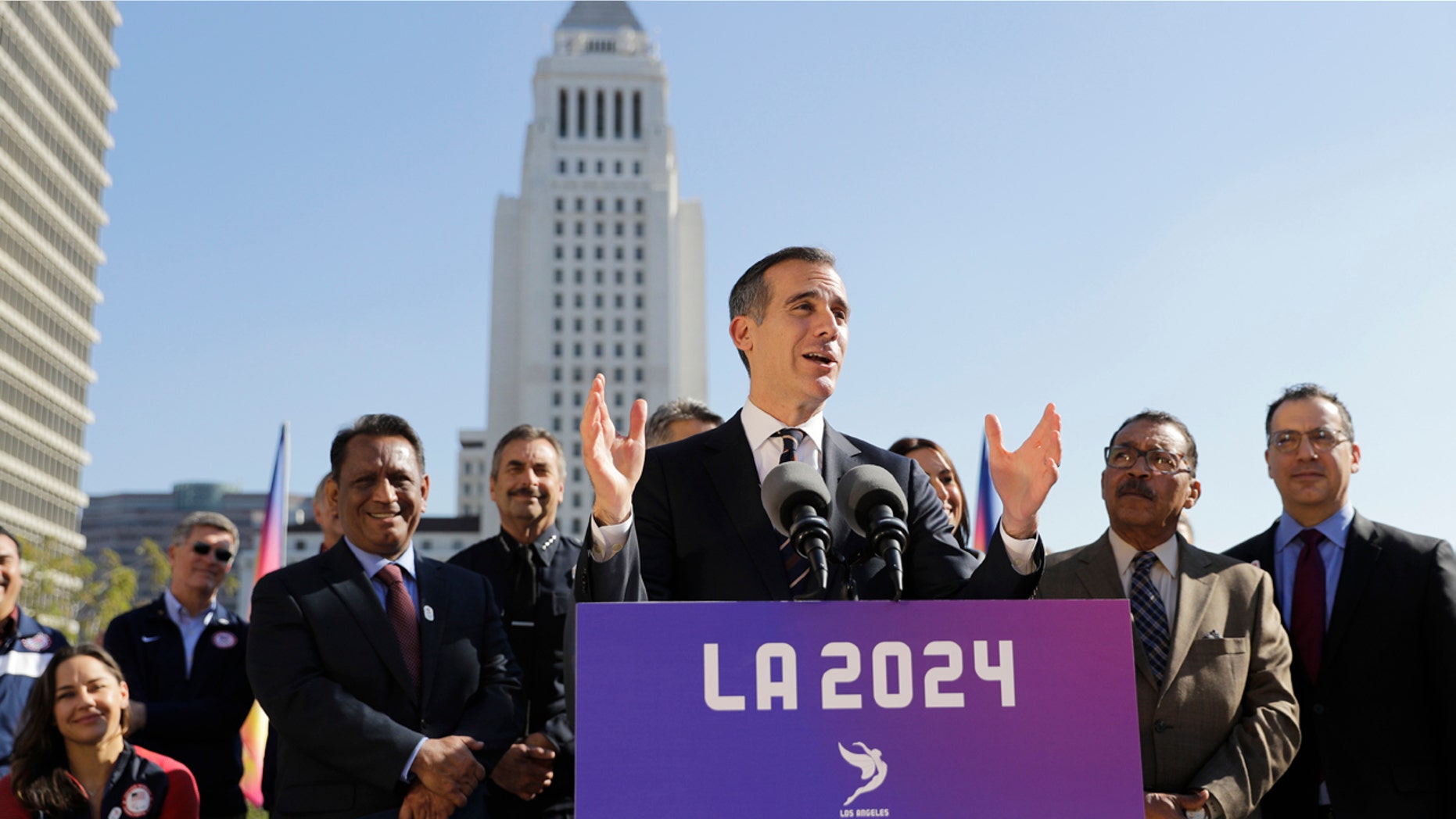 Los Angeles Mayor Eric Garcetti, center, speaks during a news conference Wednesday, Jan. 25, 2017, in Los Angeles.