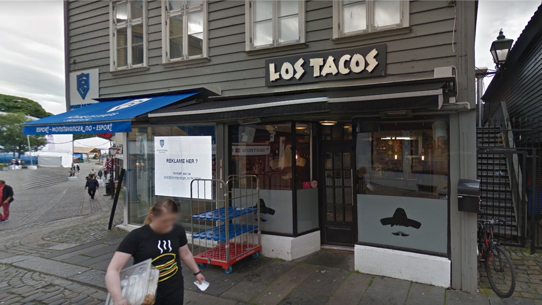 A new location of Los Tacos in Norway is trolling Trump with its window sign.