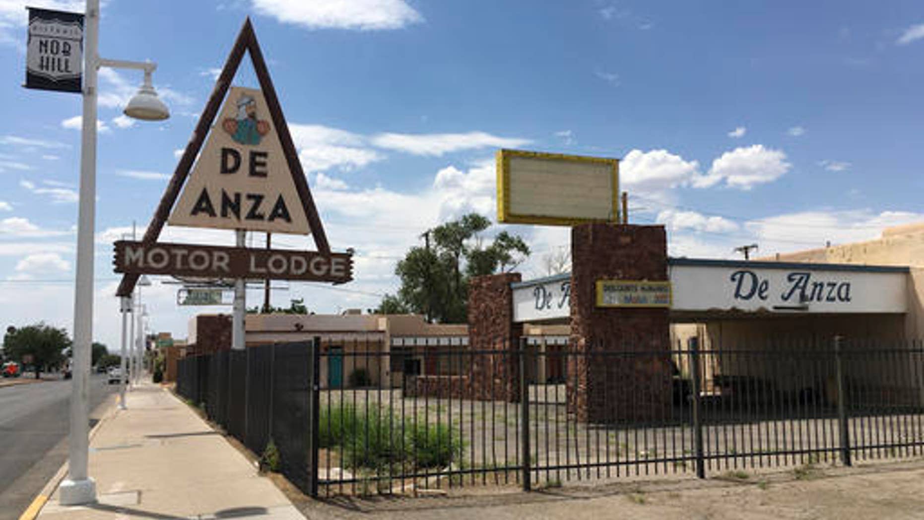 FILE - This June 24, 2016 file photo, shows the abandoned De Anza Motor Lodge in Albuquerque, N.M., along Route 66. Some sites linked to key moments of the nation's civil rights are overlooked, neglected and at-risk of being forgotten. In another part of New Mexico, there is a ghost town of a once thriving all-black settlement in the New Mexico desert rarely appears on tourist maps. (AP Photo/Russell Contreras, File)