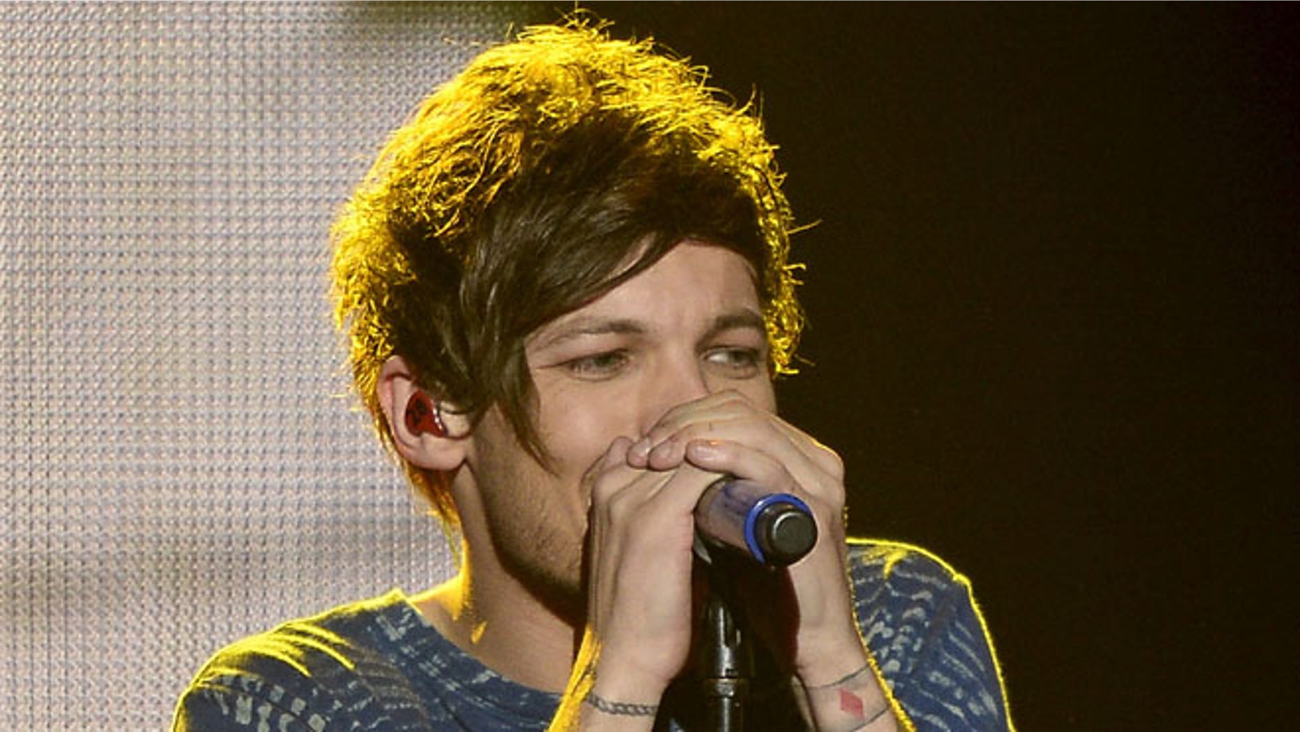 Louis Tomlinson performed on "The X Factor" days after his mother's death.