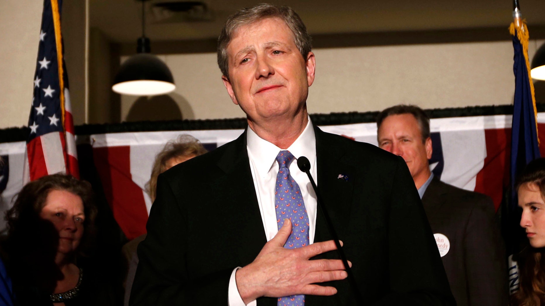 Louisiana state treasurer John Kennedy addresses supporters at his election watch party, after being elected to the senate seat vacated by Sen. David Vitter, R-La., in Baton Rouge, La., Saturday, Dec. 10, 2016. Left is his wife Becky Kennedy. (AP Photo/Gerald Herbert)