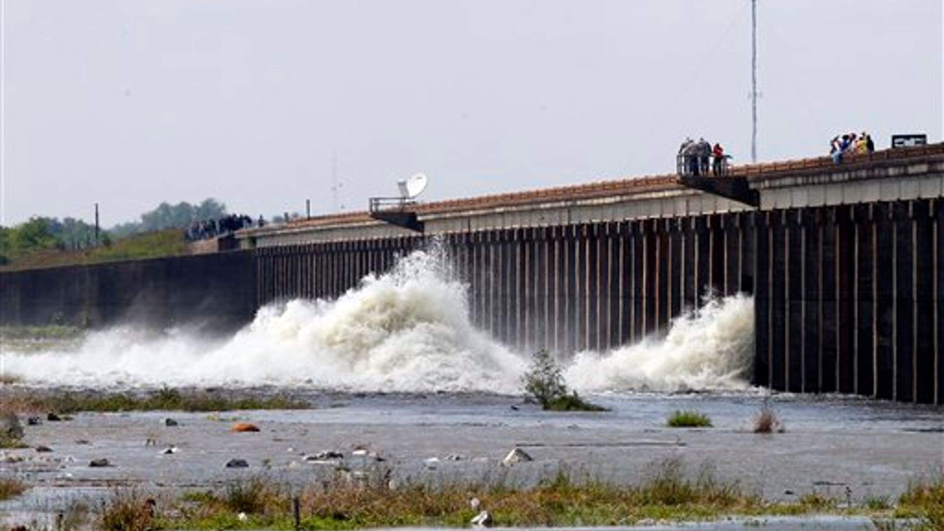 May 14: Water diverted from the Mississippi River spills through a bay in the Morganza Spillway in Morganza, La. A steel, 10-ton floodgate was slowly raised Saturday for the first time in nearly four decades, unleashing a torrent of water from the Mississippi River, away from heavily populated areas downstream. (AP)