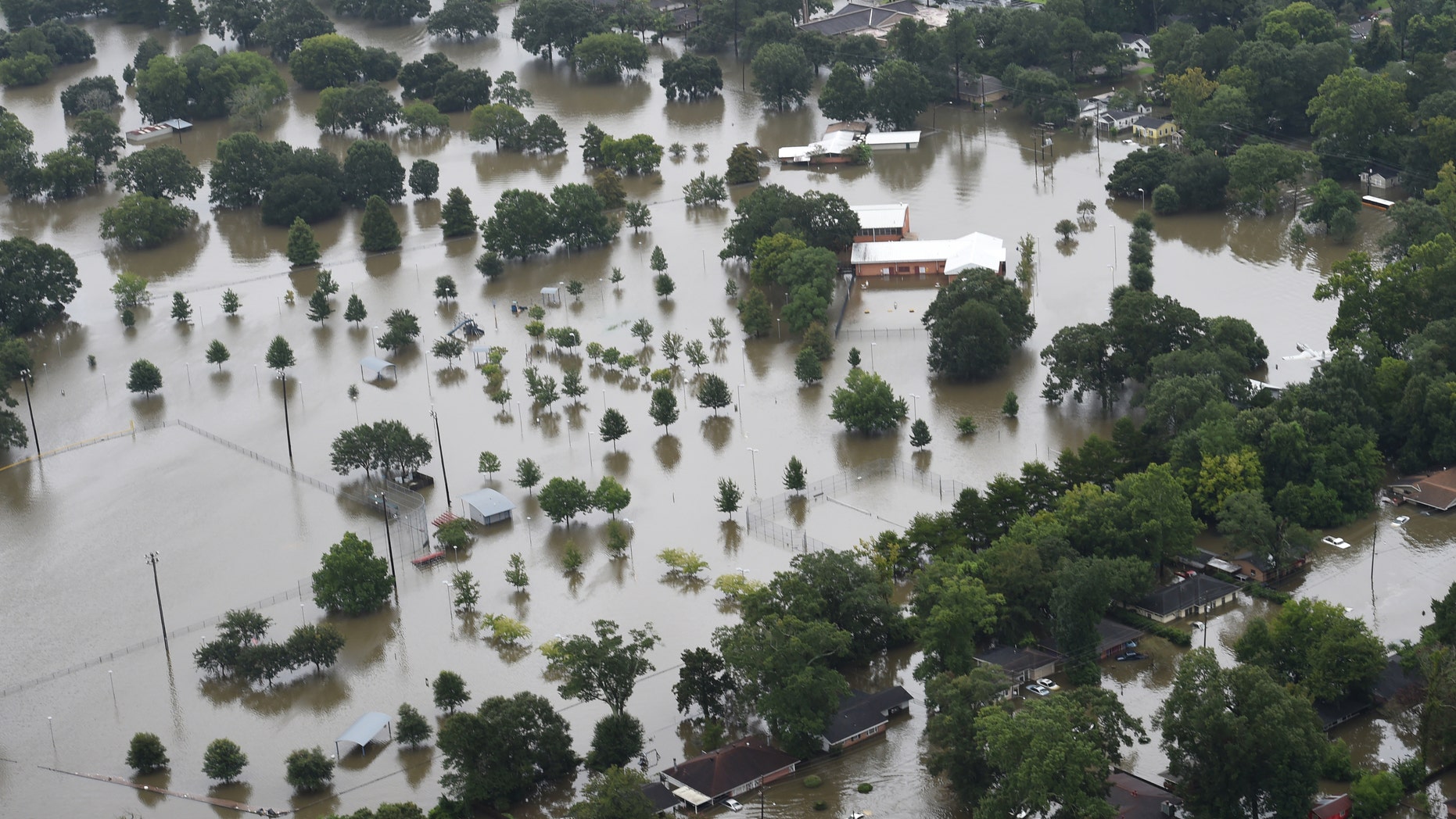 This aerial image shows flooded areas of North Baton Rouge, La., Saturday, Aug. 13, 2016. (Patrick Dennis/The Advocate via AP)