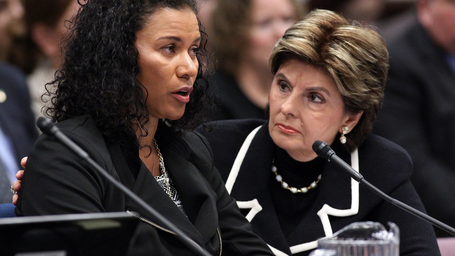 March 13, 2015. Attorney Gloria Allred, right, listens as Lise-Lotte Lublin testifies in a hearing at the Legislative Building in Carson City, Nev.