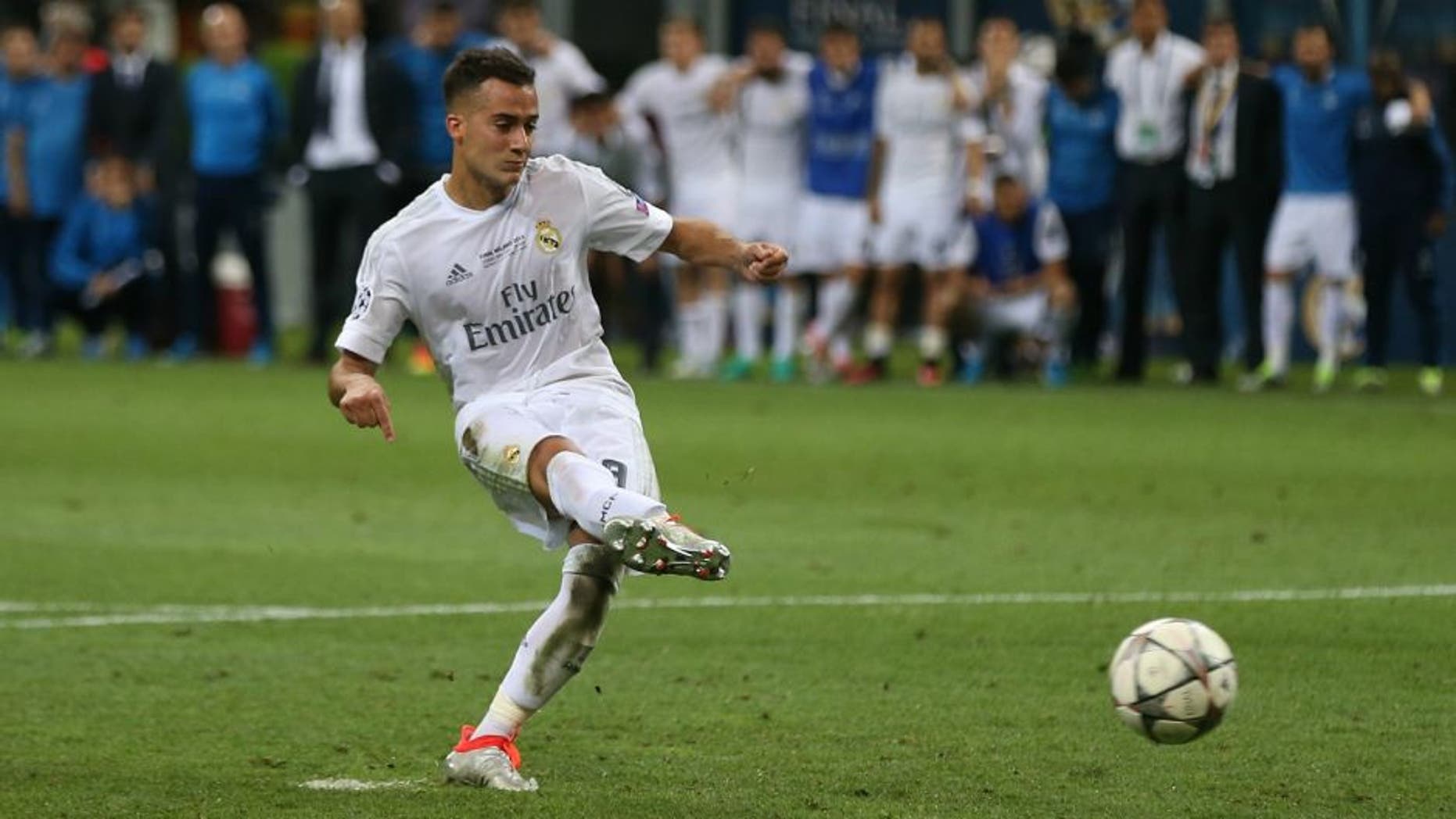 MILAN, ITALY - MAY 28: Lucas Vazquez of Real Madrid scores in the penalty shoot-out during the UEFA Champions League Final between Real Madrid and Club Atletico de Madrid at Stadio Giuseppe Meazza on May 28, 2016 in Milan, Italy. (Photo by Chris Brunskill Ltd/Getty Images)