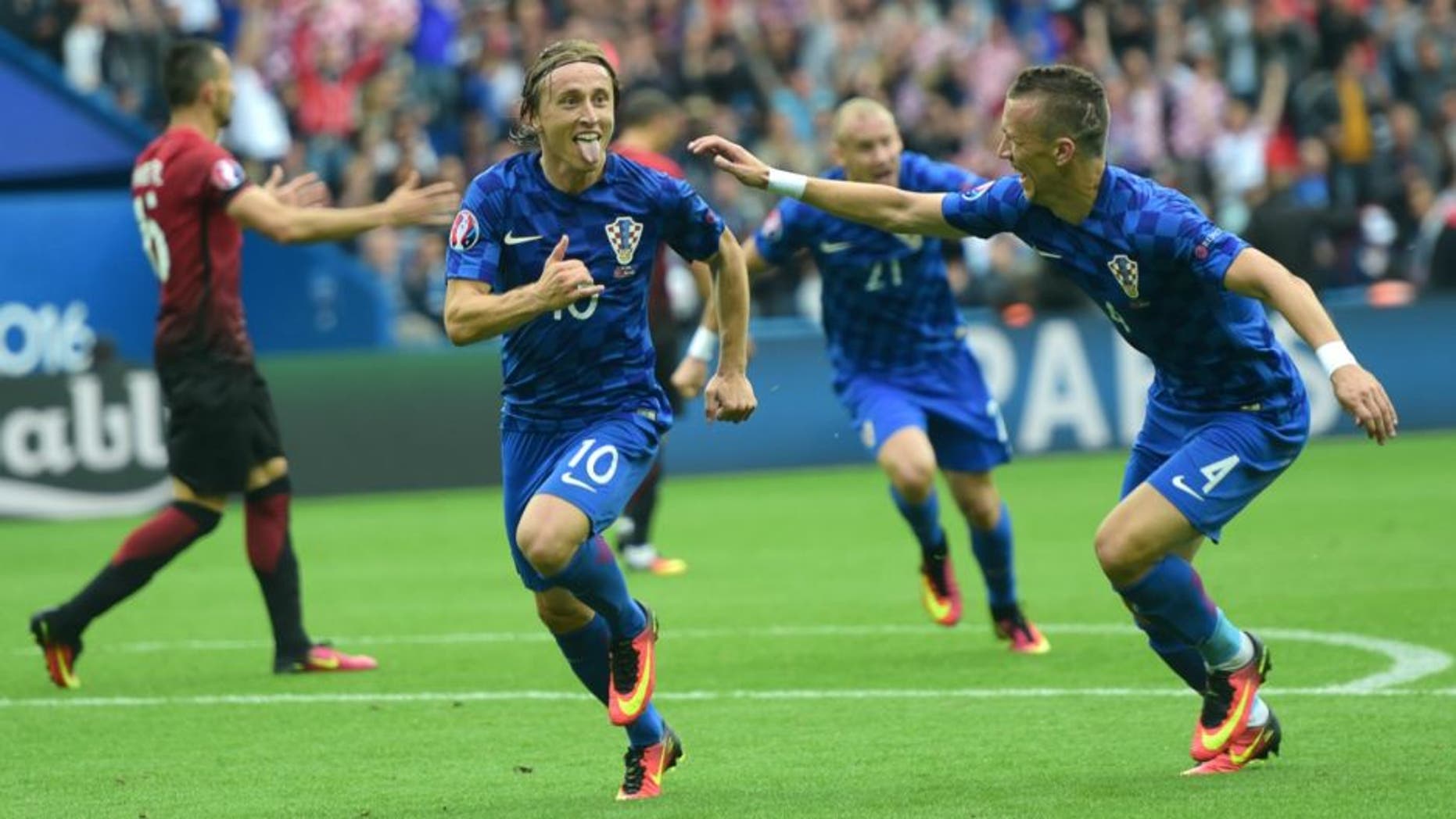 Croatia's midfielder Luka Modric (C) celebrates a goal during the Euro 2016 group D football match between Turkey and Croatia at Parc des Princes in Paris on June 12, 2016. / AFP / BULENT KILIC (Photo credit should read BULENT KILIC/AFP/Getty Images)