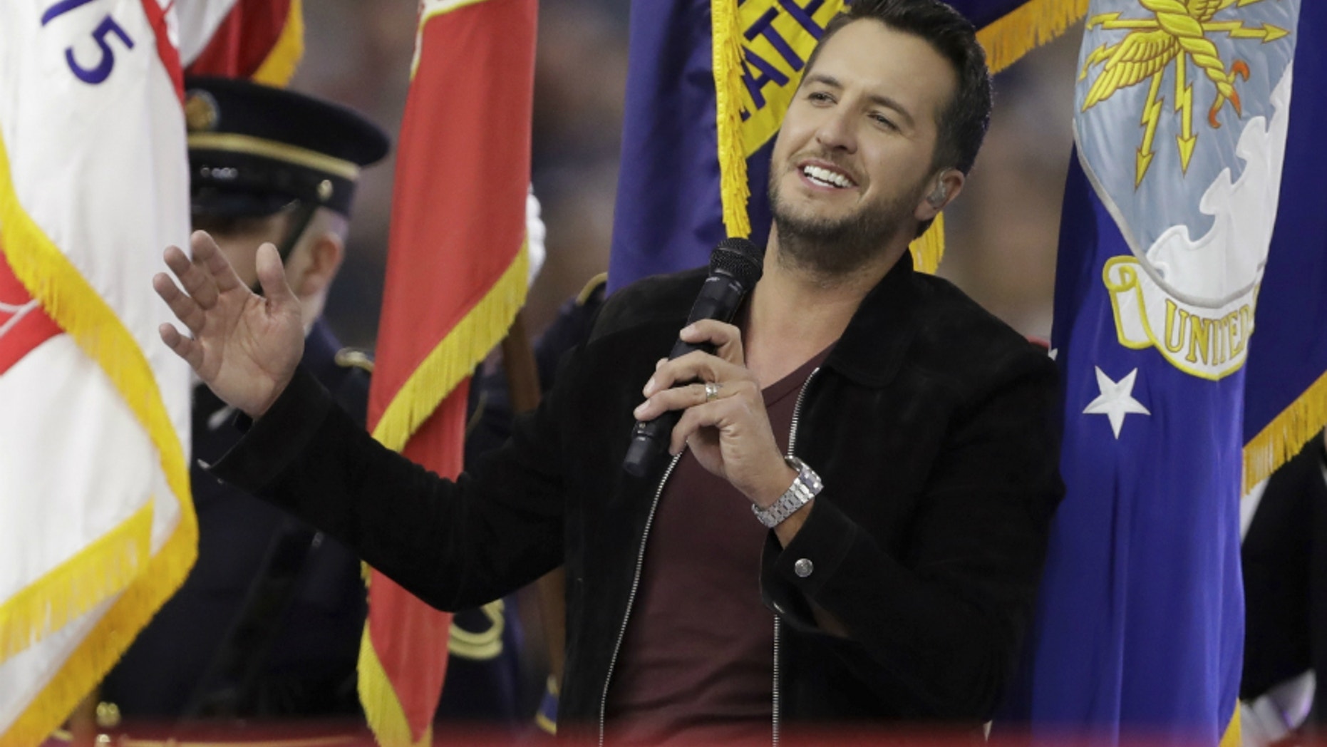 Country music singer Luke Bryan sings the National Anthem, before the NFL Super Bowl 51 football game between the New England Patriots and the Atlanta Falcons, Sunday, Feb. 5, 2017, in Houston.