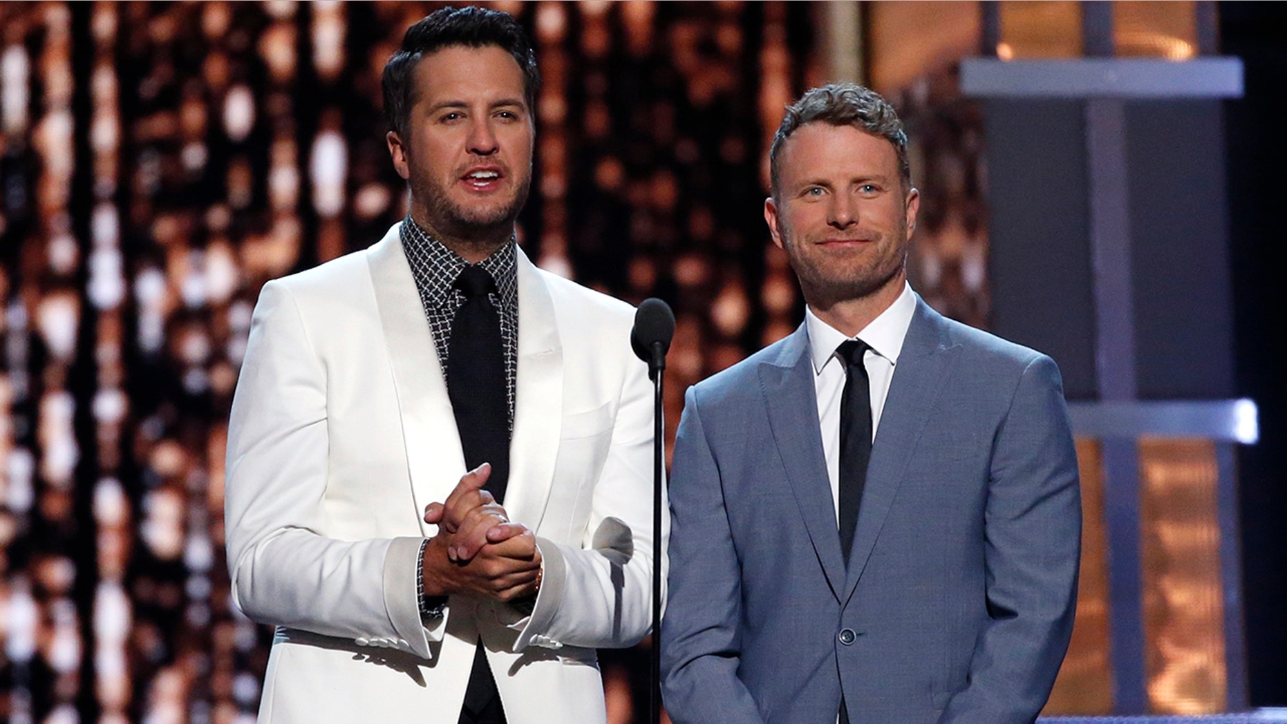 Luke Bryan (L) and Dierks Bentley host the 52nd Academy of Country Music Awards in Las Vegas, Nevada on April 2, 2017.