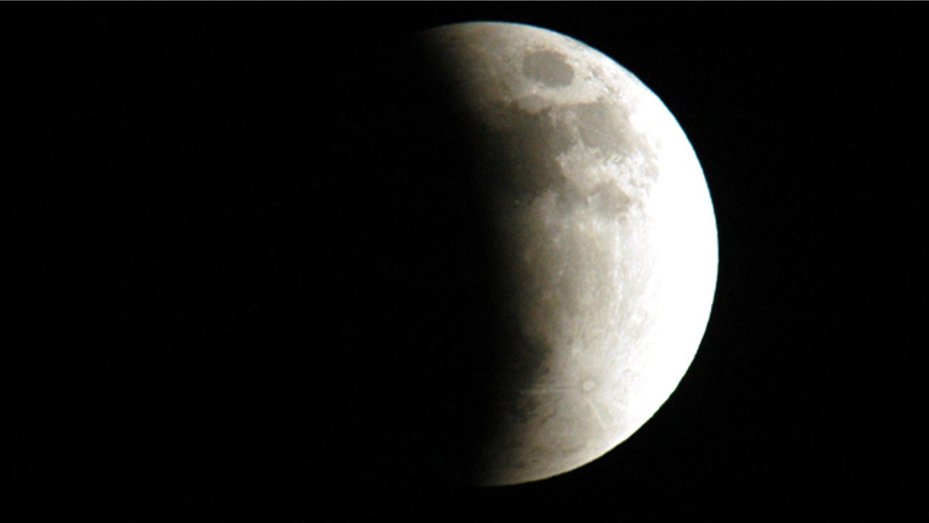 The start of a lunar eclipse viewed from Merritt Island, Fla., in 2003. Eclipses occur when the Sun, Earth and Moon line up. They are rare because the Moon usually passes above or below the imaginary line connecting Earth and the Sun.