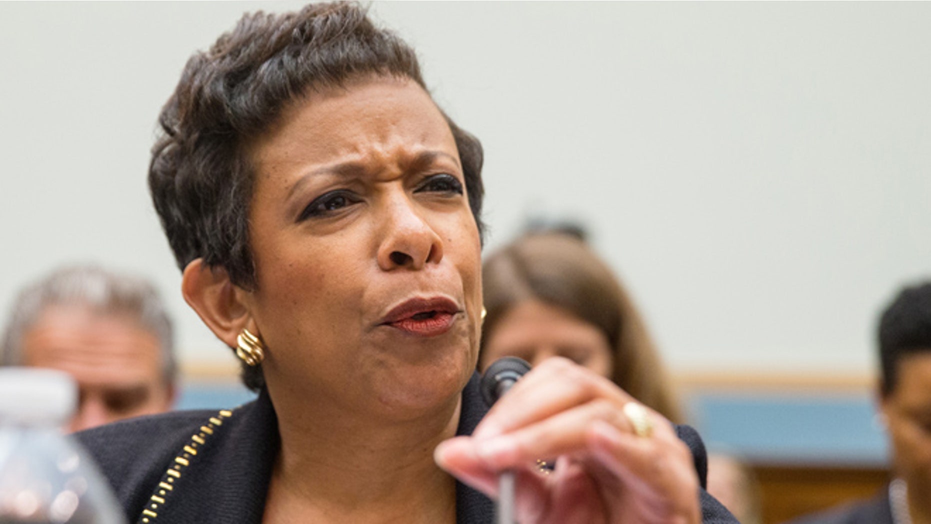 Nov. 17, 2015: Attorney General Loretta Lynch adjusts her microphone prior to testifying on Capitol Hill in Washington before the House Judiciary Committee hearing: "Oversight of the United States Department of Justice" (AP)