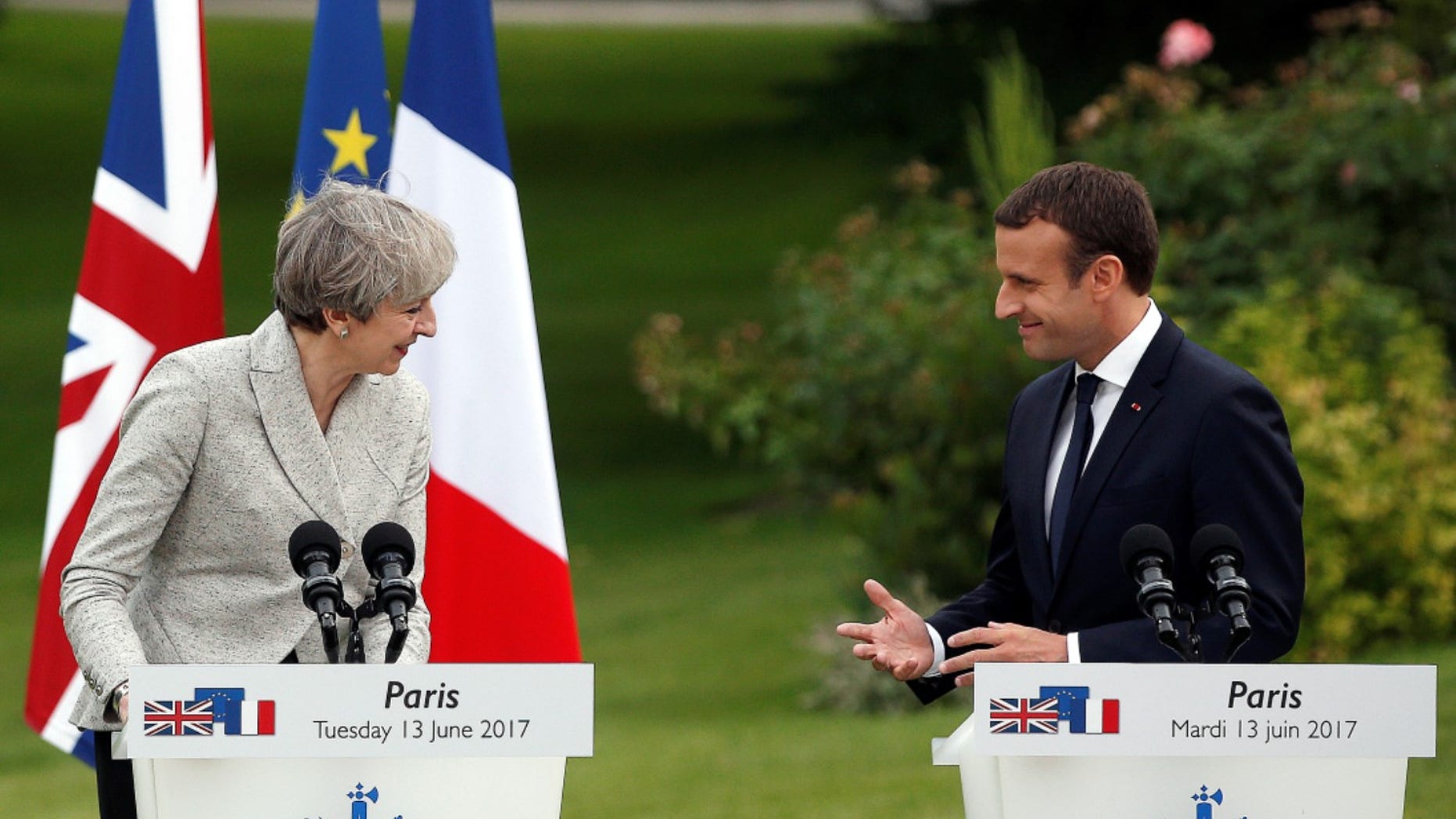 French President Emmanuel Macron, right, and Britain's Prime Minister Theresa May, spoke at a joint press conference, after a meeting, at the Elysee Palace, in Paris, Tuesday, June 13, 2017. (AP Photo/Thibault Camus)