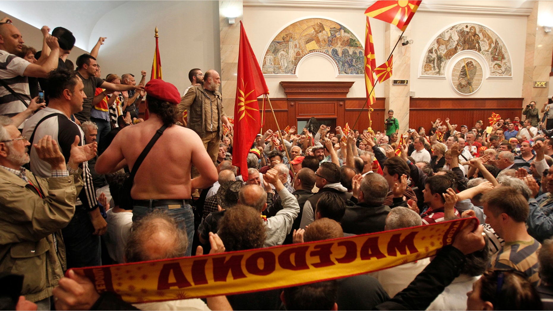 Protesters enter into the parliament building in Skopje, Macedonia, Thursday, April 27, 2017.