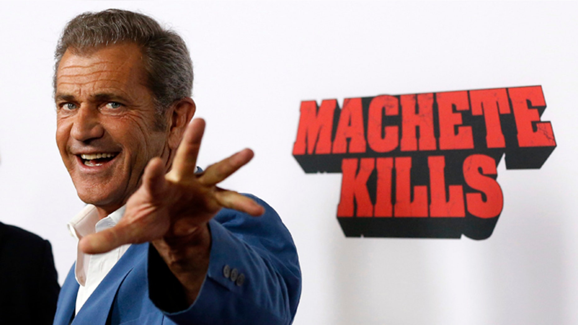 Cast member Mel Gibson poses at the premiere of "Machete Kills" in Los Angeles, California October 2, 2013. The movie opens in the U.S. on October 11. REUTERS/Mario Anzuoni (UNITED STATES - Tags: ENTERTAINMENT PROFILE) - RTR3FJHD