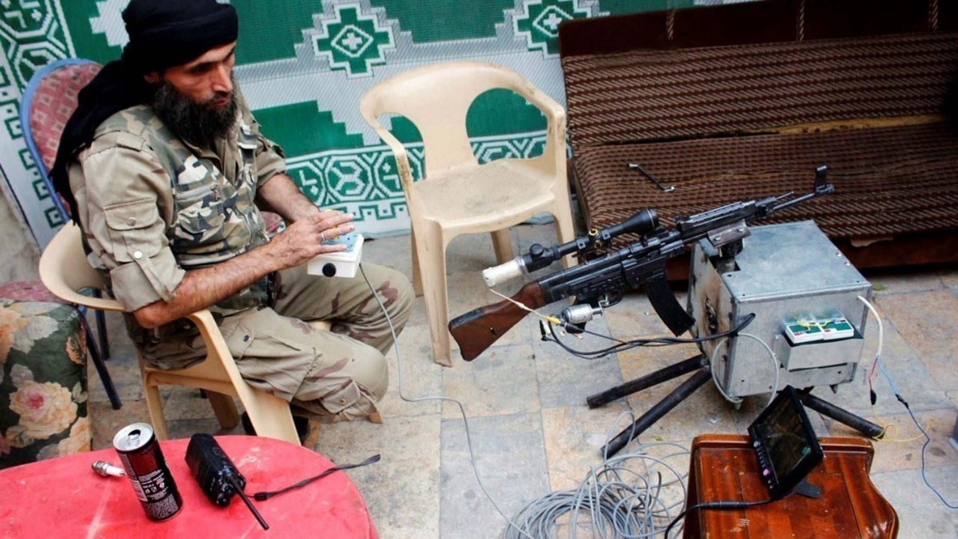 A Free Syrian Army rebel is seen with a remotely-operated StG-44.