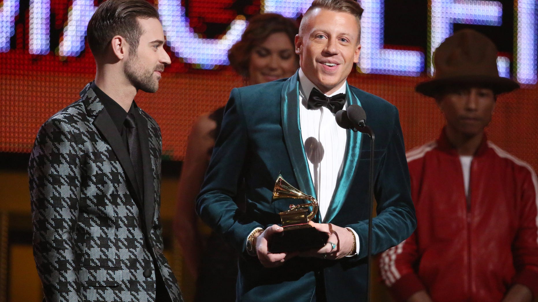 Ryan Lewis, left, and Macklemore accept the award for best new artist at the 56th annual Grammy Awards at Staples Center on Sunday, Jan. 26, 2014, in Los Angeles. (Photo by Matt Sayles/Invision/AP)
