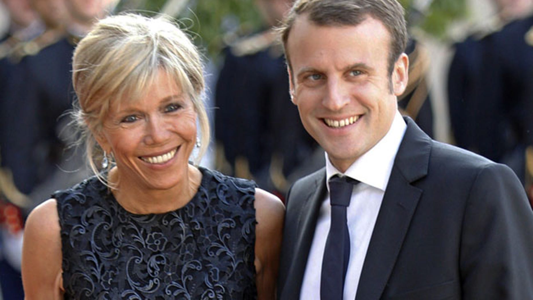 Emmanuel Macron is seen with his wife Brigitte Trognuex at the Elysee Palace in Paris, France, June 2, 2015.