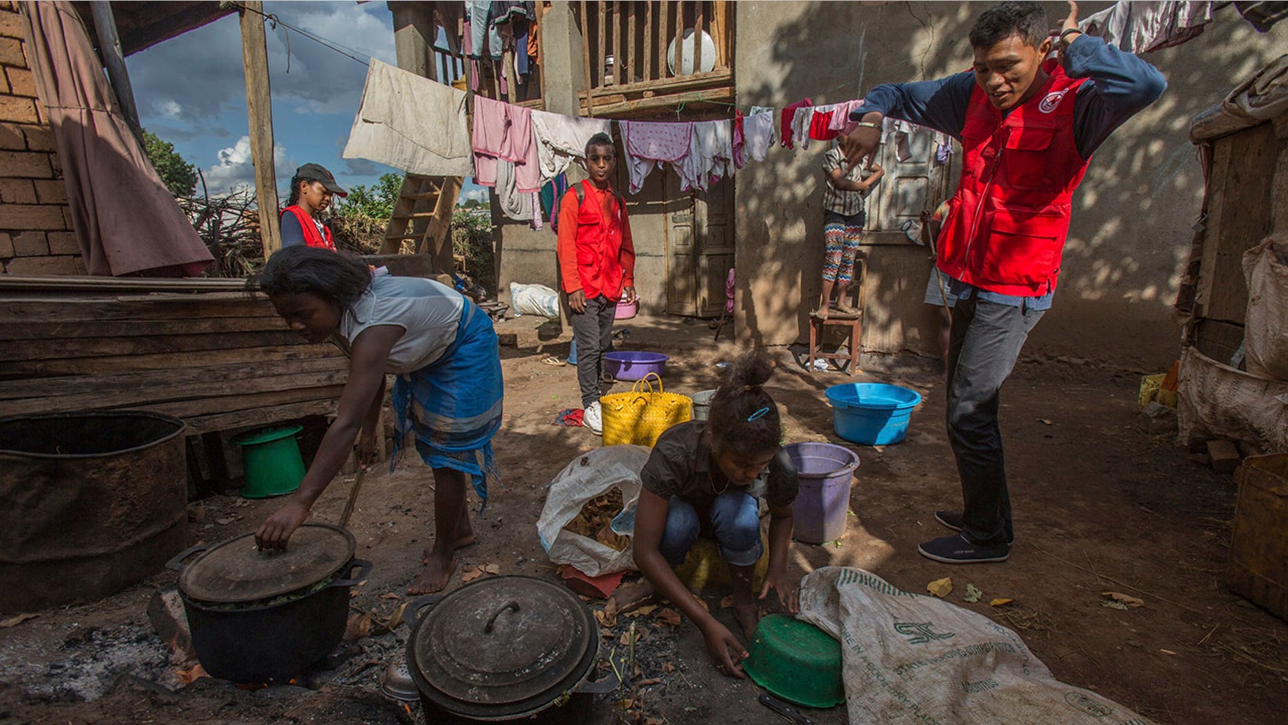 The tradition involves exhuming the bodies of the dead, rewrapping them in fresh cloth and then dancing with the wrapped corpses before returning the remains to their graves.
