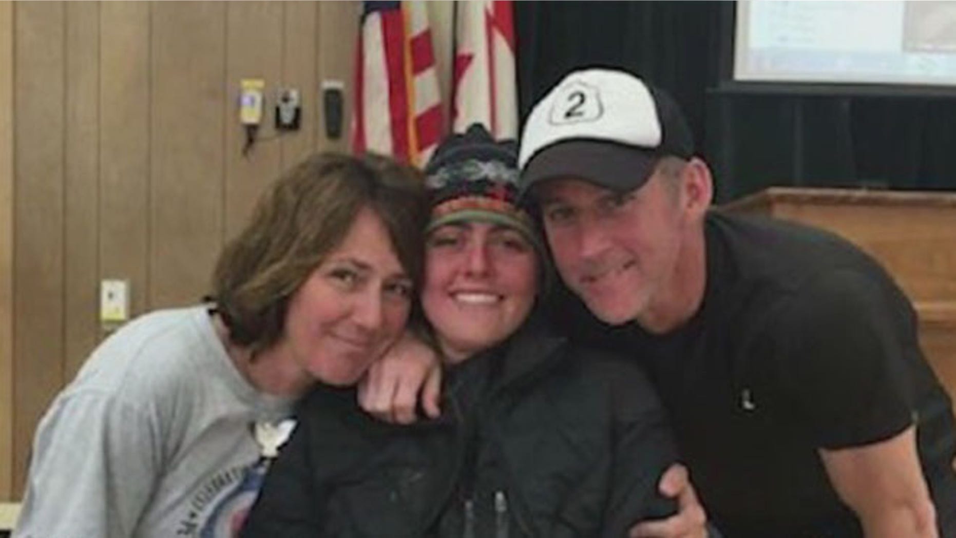 Missing hiker Madeline Connelly 23, got hugs from her parents at Glacier Park Headquarters after being found.