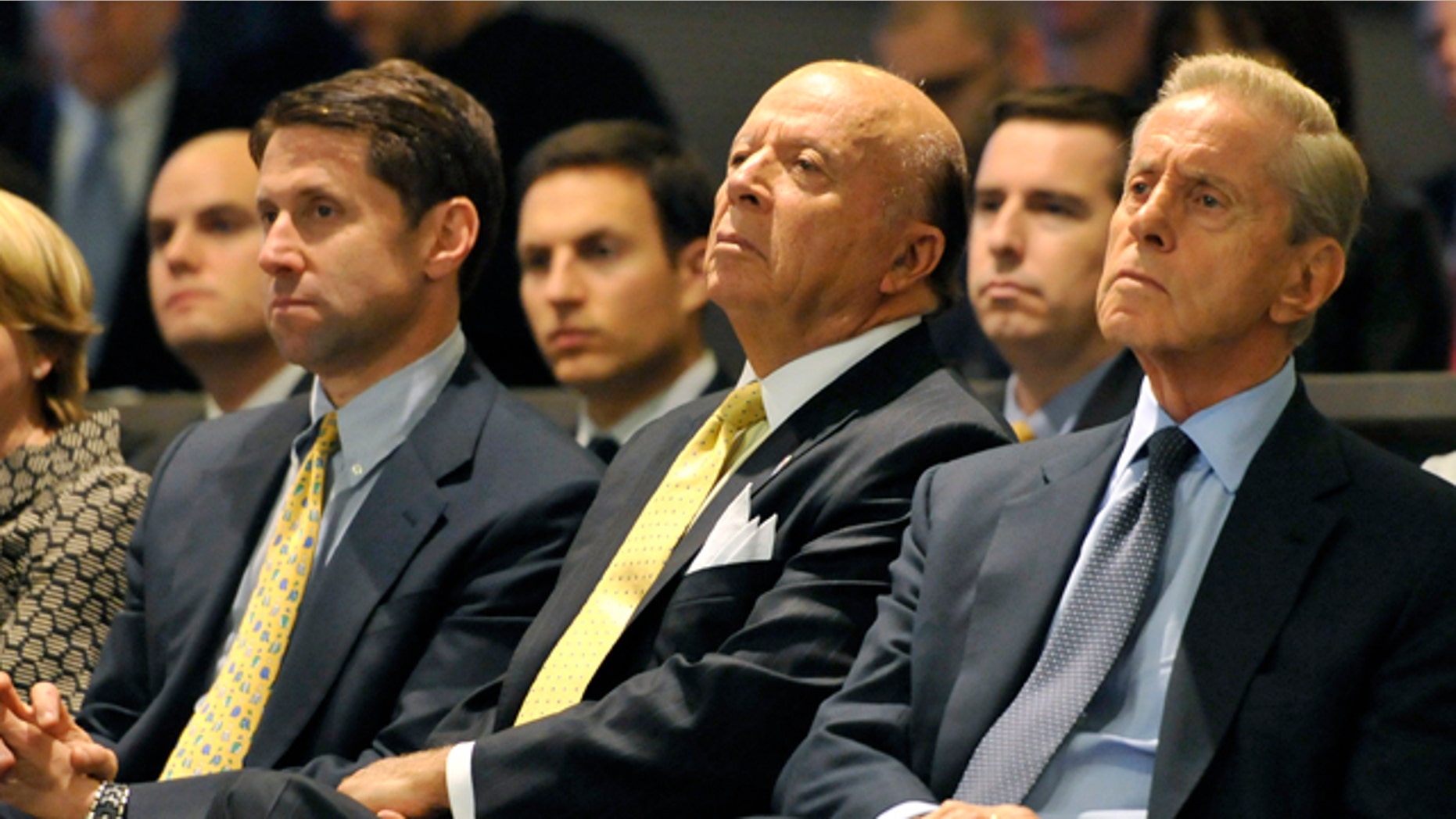 Oct. 29, 2010: FILE - This photo shows New York Mets owners from left, Jeff Wilpon, Saul Katz and Fred Wilpon during a baseball news conference in New York. The Mets owners and a trustee for Bernard Madoff's fraud victims have settled for $162 million.