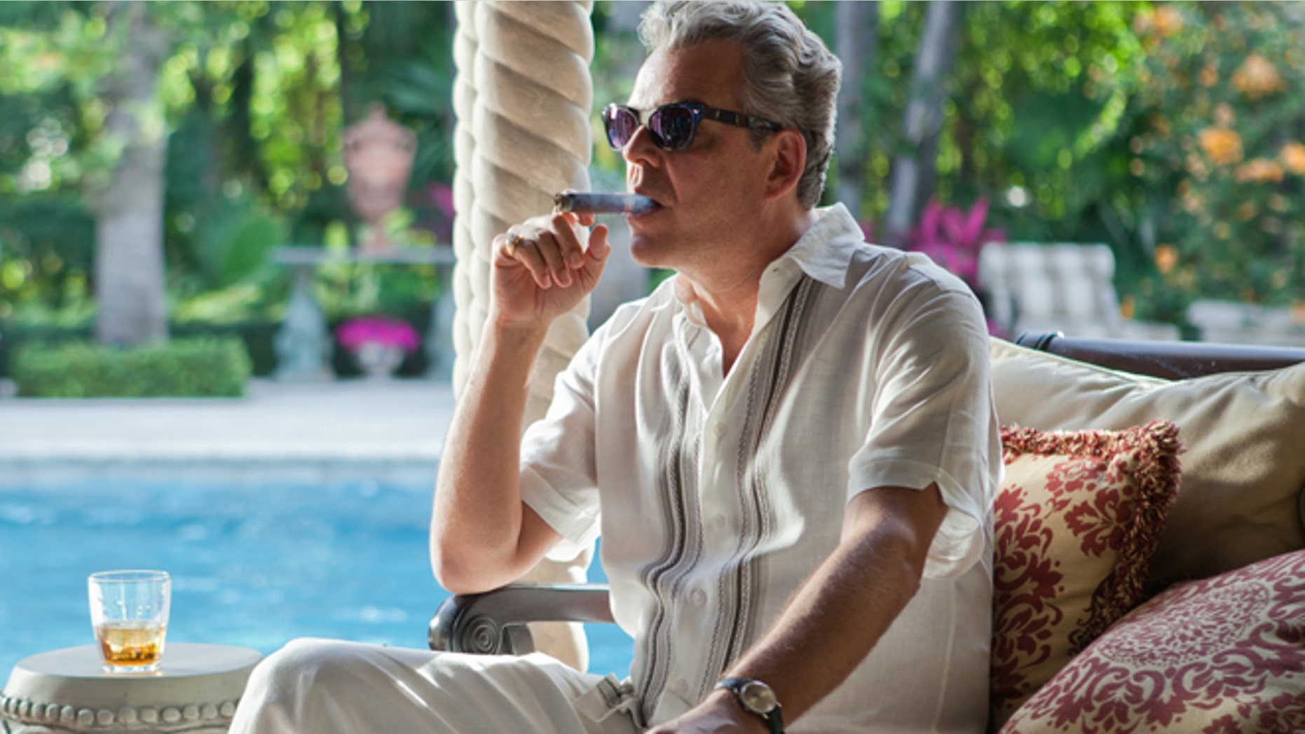 This publicity image released by Starz, shows Danny Huston in a scene from the second season of the series "Magic City," set in Miami, Fla.
