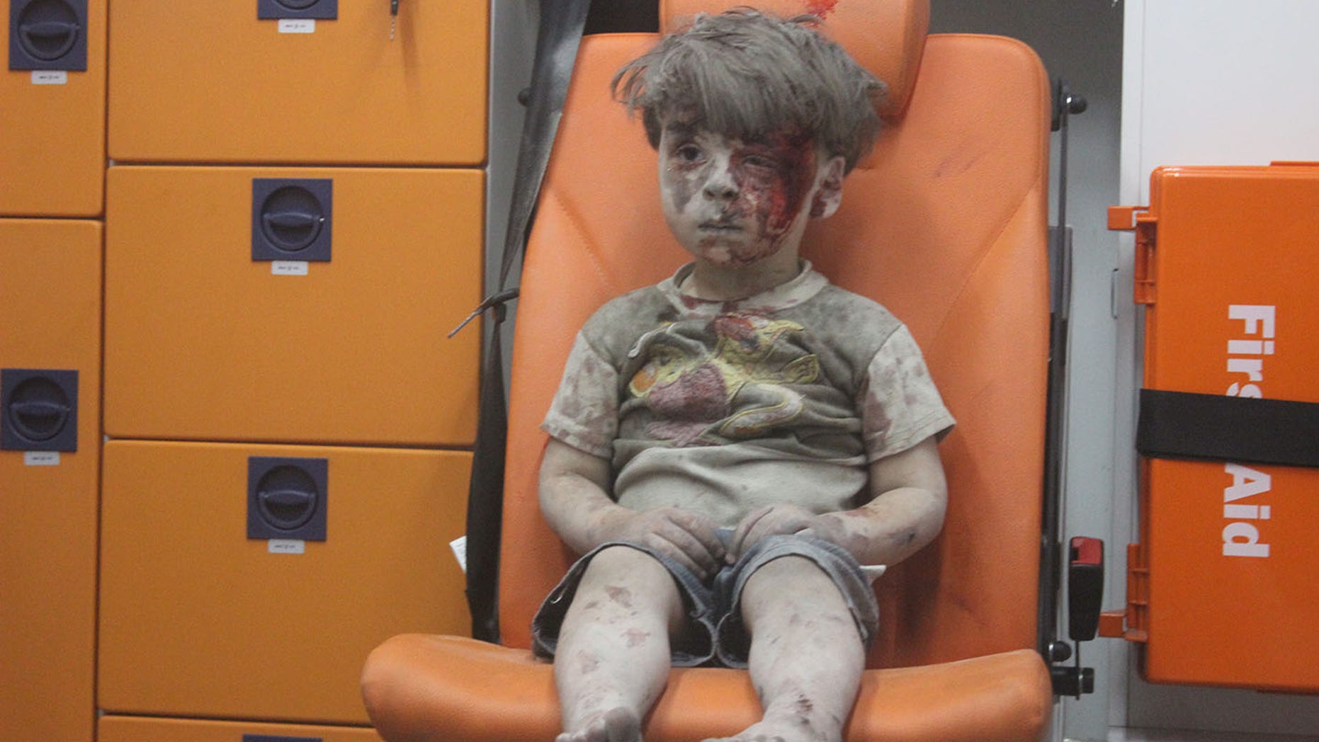 Omran Daqneesh sits in an ambulance after being pulled out of a building hit by an airstrike in Aleppo, Syria on Aug. 17, 2016.