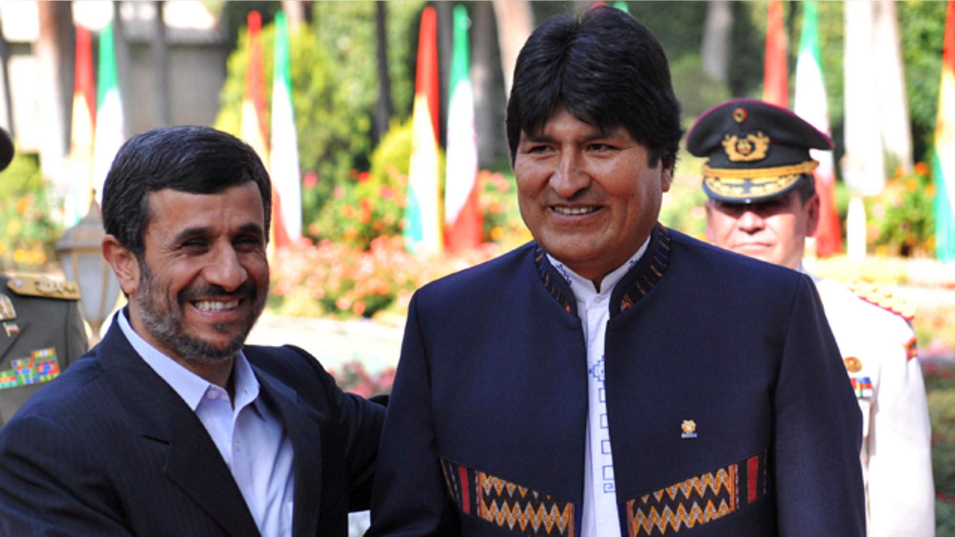 Oct. 26: Iranian President Mahmoud Ahmadinejad, left, shakes hands with his Bolivian counterpart Evo Morales, during an official welcoming ceremony for him, in Tehran, Iran. (AP/ISNA)