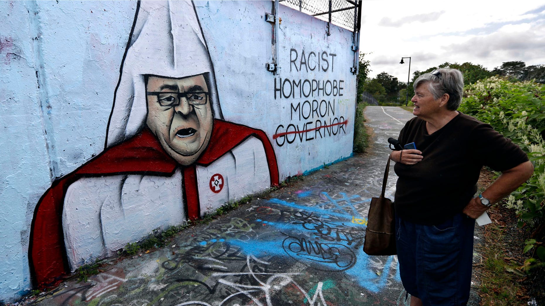 Sept. 6, 2016: Graffiti painted on a public art space depicts Gov. Paul LePage in a white hood and robe with a red Ku Klux Klan insignia.