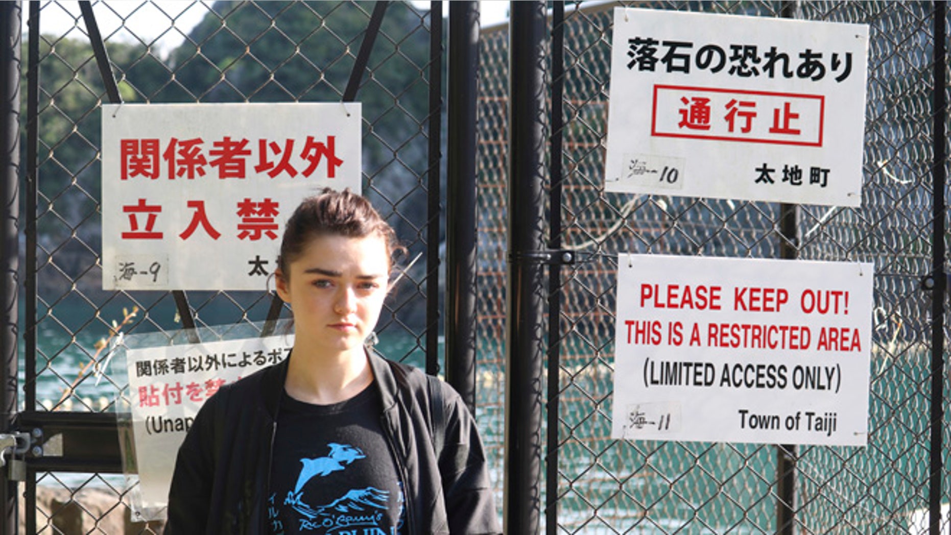 Maisie Williams at a beach known for dolphin hunting in Taiji, Japan.