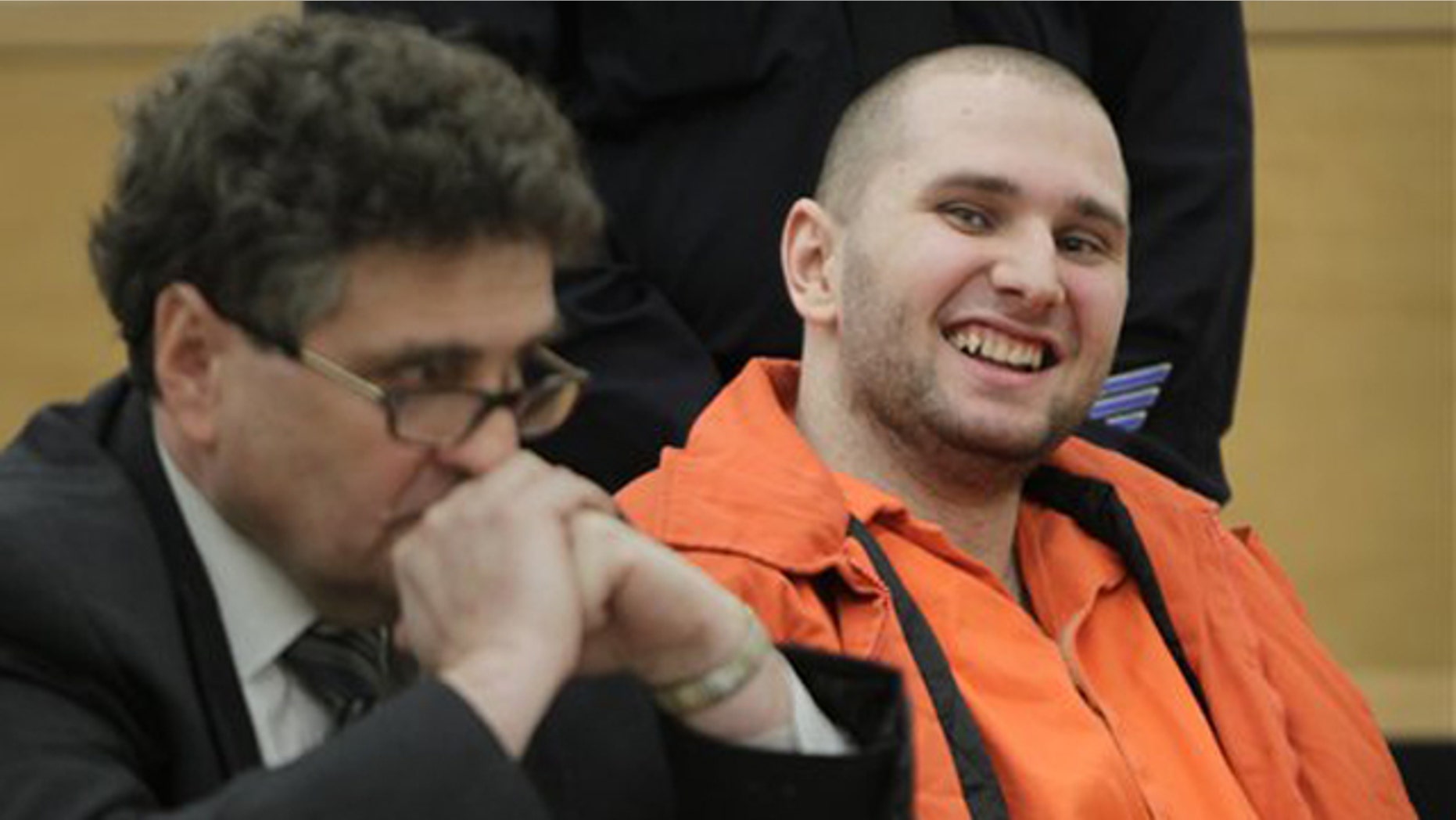 Jan. 18, 2012: Maksim Gelman, right, laughs during his sentencing at Supreme Court in New York.