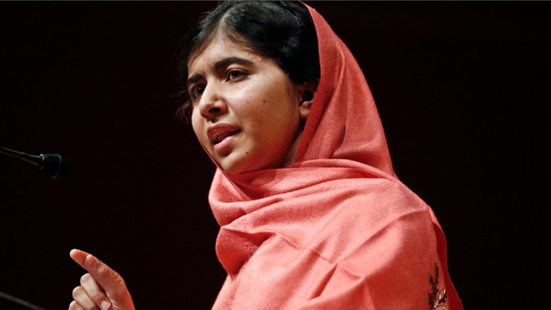 Sept. 27, 2013: In this file photo, Malala Yousafzai addresses students and faculty after receiving the 2013 Peter J. Gomes Humanitarian Award at Harvard University in Cambridge, Mass.