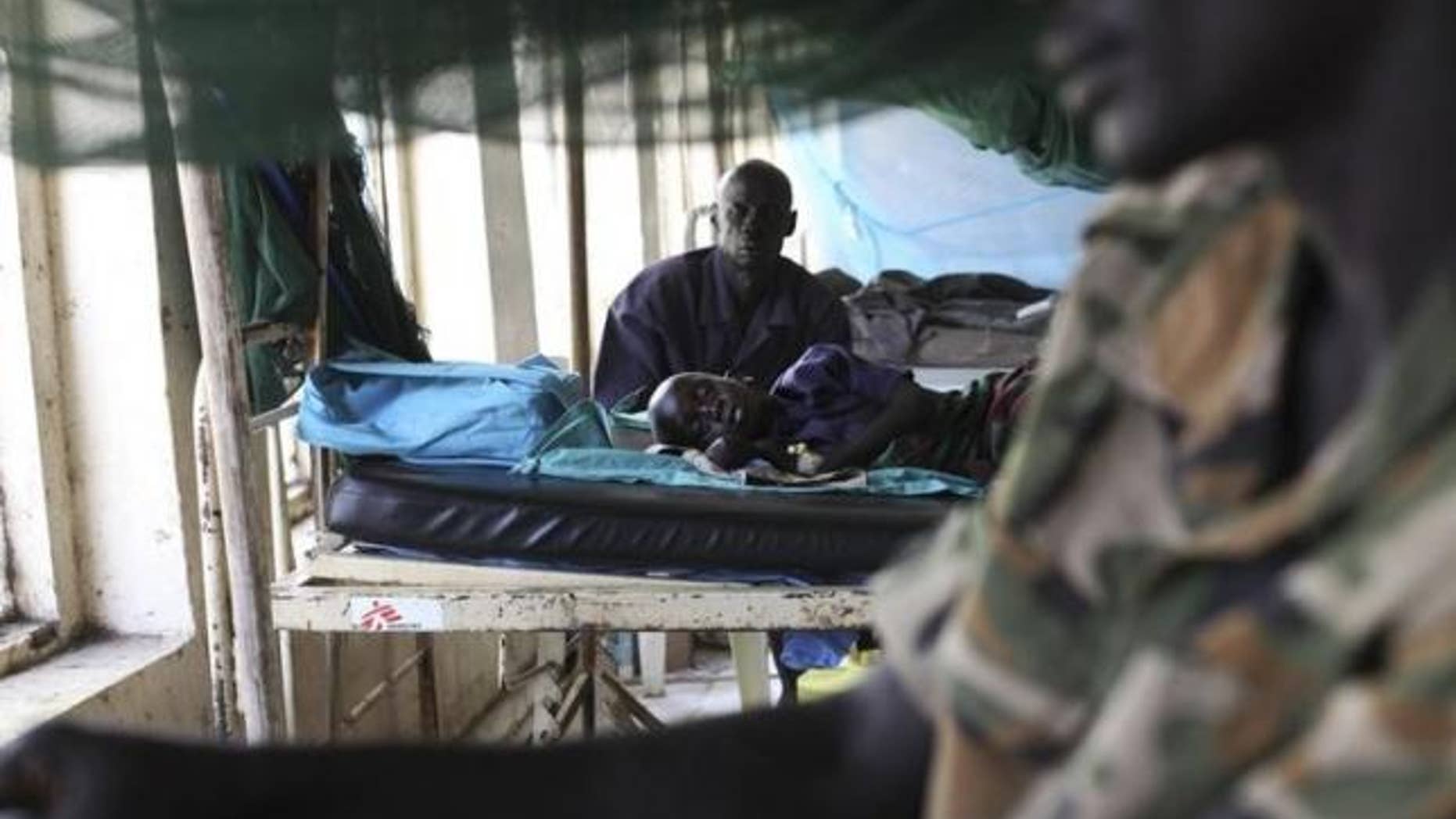 March 15, 2014: A child sick with malaria and from malnutrition lies on a bed in a hospital in Bor.