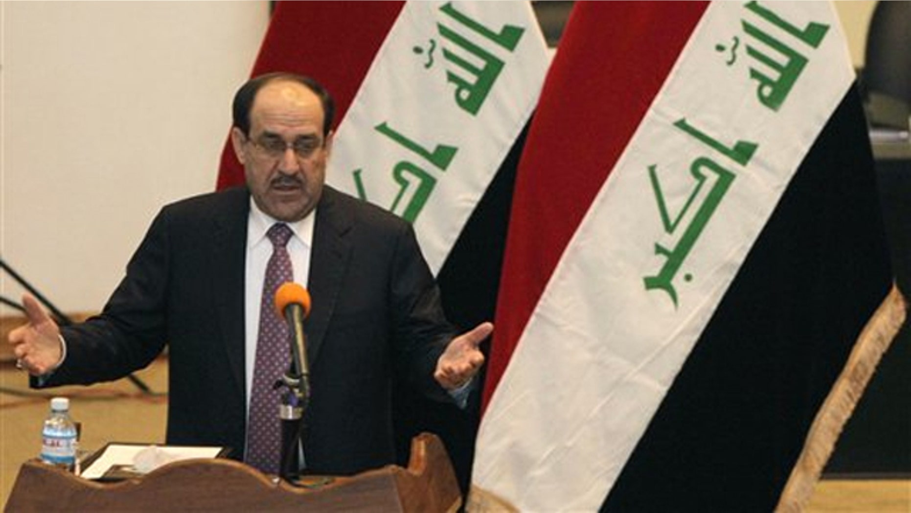 Iraqi Prime Minister Nouri al-Maliki speaks to Iraqi lawmakers before submitting his new government for approval in Baghdad, Iraq, Dec. 21.