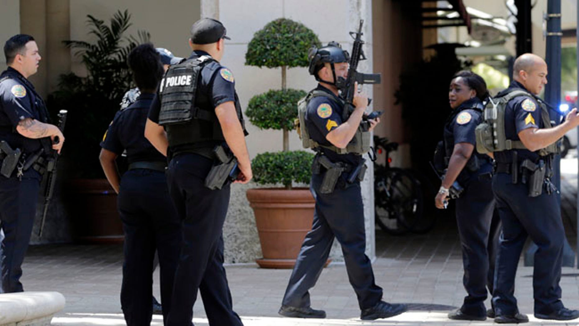 Police patrol outside of the Shops at Merrick Park after a shooting Saturday in Coral Gables, Florida.
