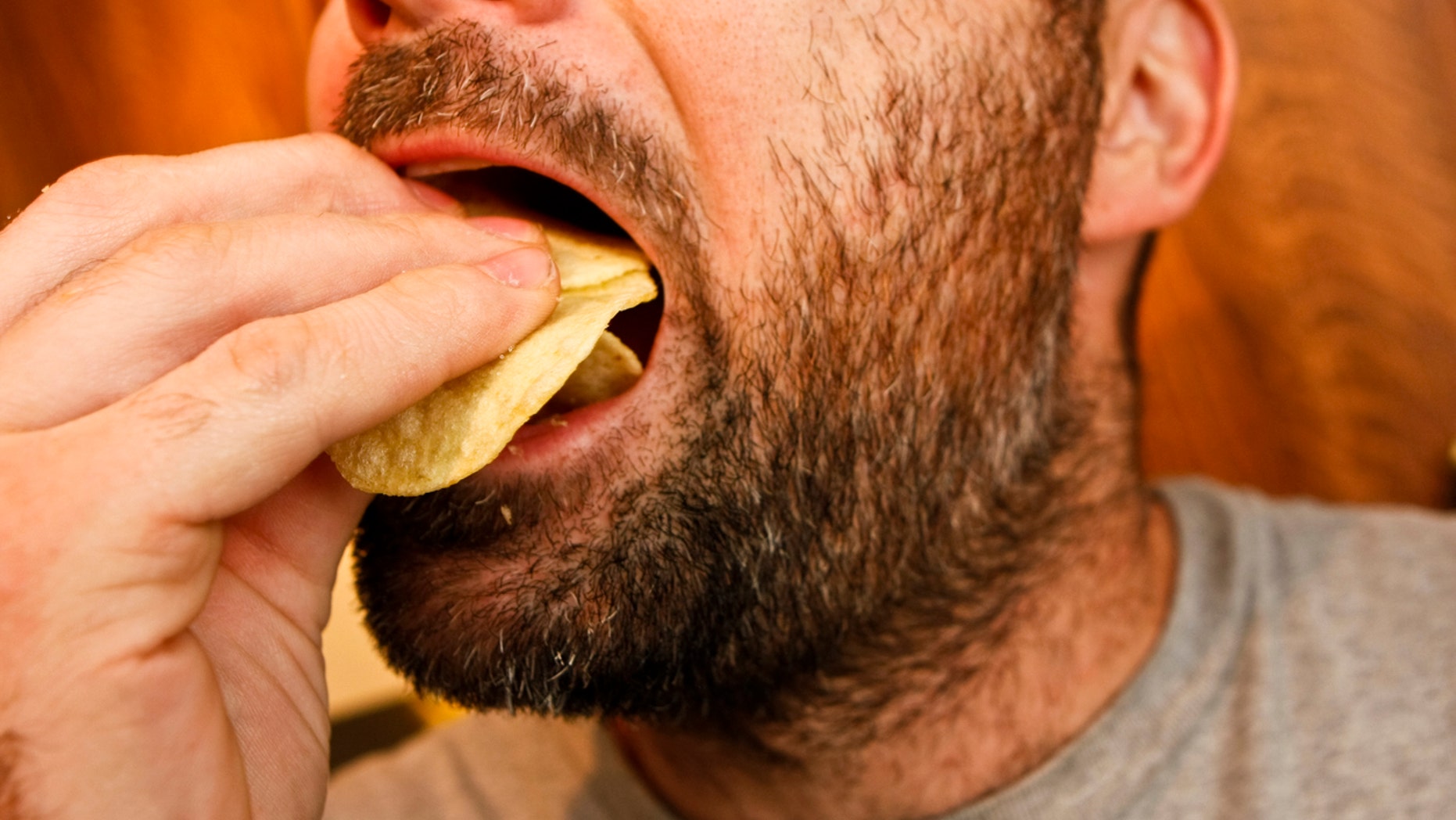 Funky dude gorges on chips. Part of my Funky Dude lightbox.