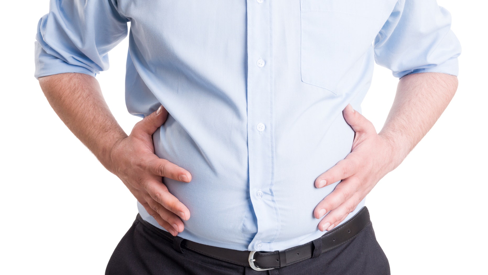 Hands grabbing bloated abdomen. Digestion problem or indigestion, medical concept.