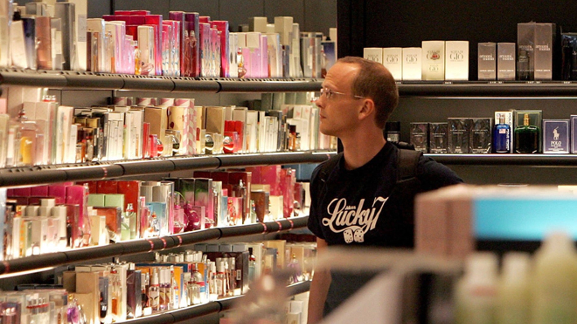 SAN FRANCISCO - AUGUST 11: A man browses fragrances at a Sephora cosmetics store in the international terminal at San Francisco International Airport August 11, 2006 in San Francisco, California. Businesses at airports are bracing for a financial hit after the Transportation Security Administration imposed a ban on all liquids and gels aboard flights as part of the Department of Homeland Security raising the terrorism threat alert to highest level of "red" on August 10, for commercial flights from Britain to the United States. (Photo by Justin Sullivan/Getty Images)
