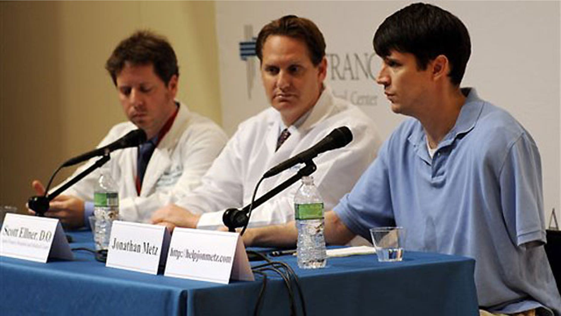 June 15: Jonathan Metz speaks at a news conference at St. Francis Hospital in Hartford, Conn. Metz had his arm stuck in his furnace boiler for about 12 hours when he concluded that amputating the limb was his only chance for survival.