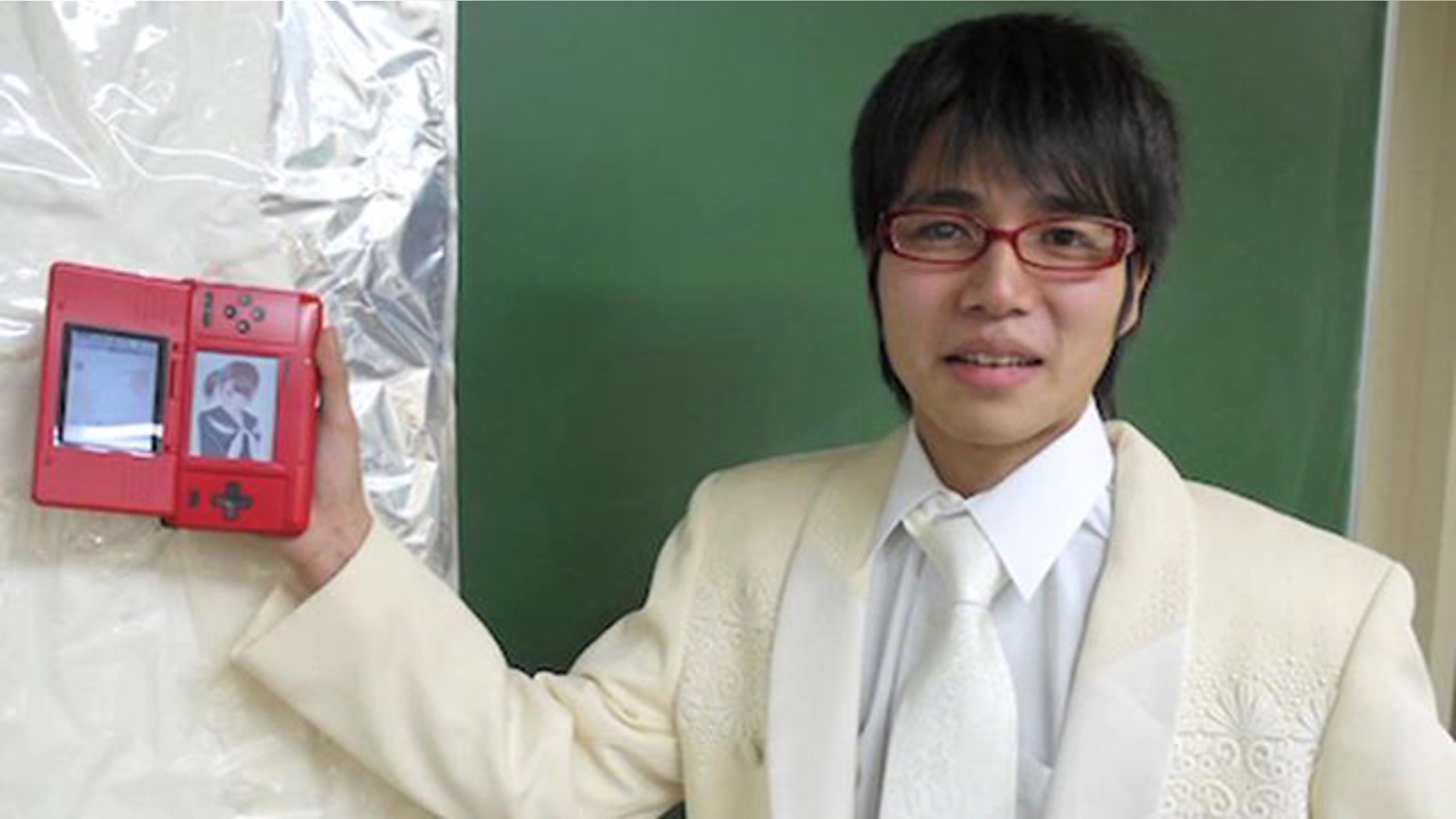 In this screen from a YouTube video of the wedding ceremony, gamer Sal9000 shows off the love of his life -- Nene Anegasaki, the star of dating simulation game Love Plus.