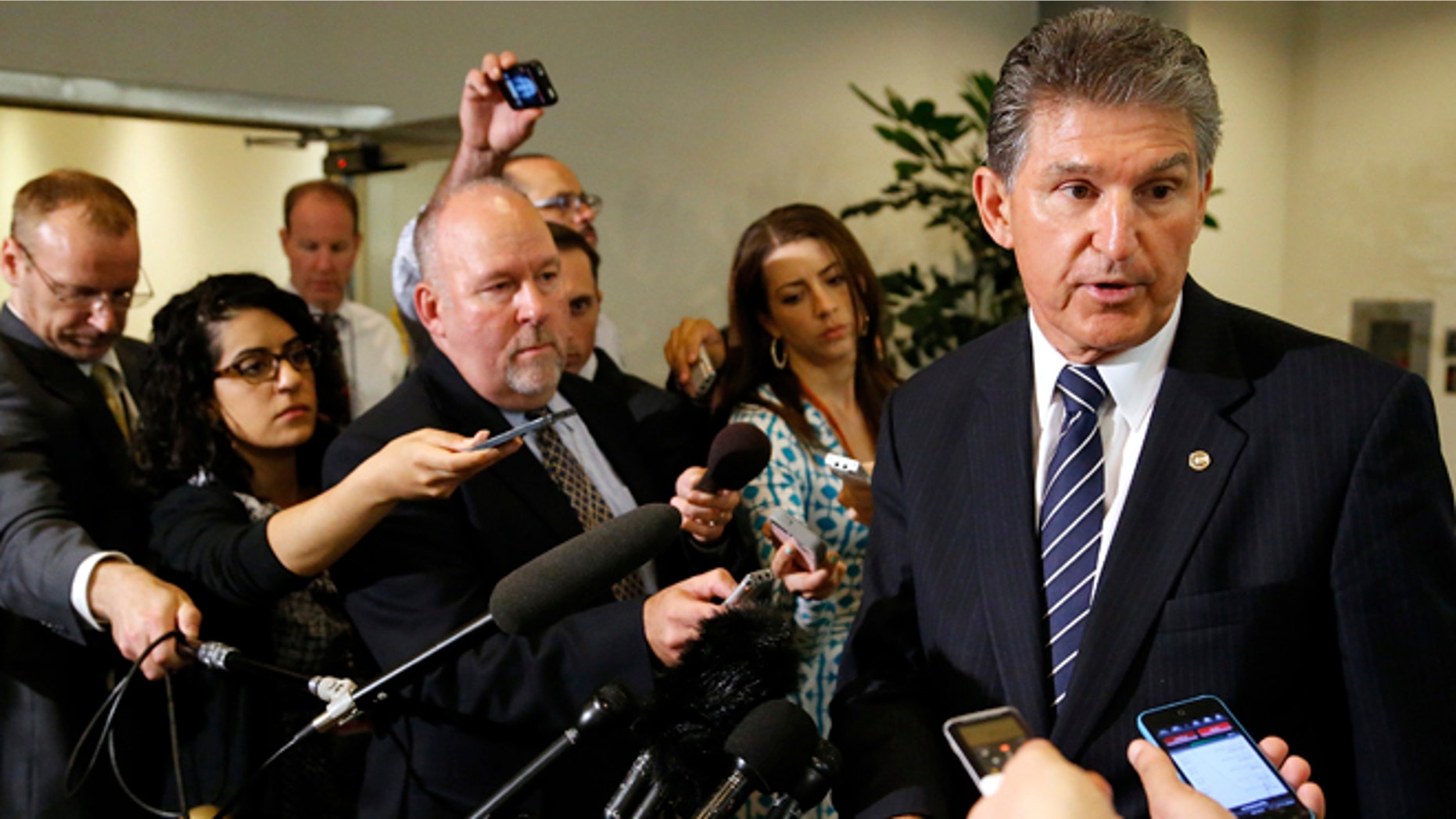 June 10, 2014: Senator Joe Manchin, D-W. Va., speaks to reporters outside of a closed-door Senate Armed Services Committee briefing on the Bergdahl prisoner swap at the U.S. Capitol in Washington.