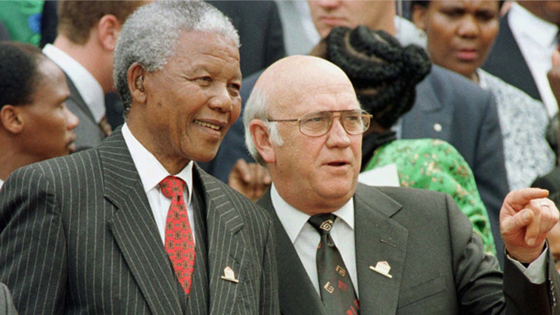 In this Wednesday May 8, 1996 file photo, South African President Nelson Mandela, left, and Deputy President F.W. de Klerk chat outside Parliament after the approval of South Africa's new constitution. de Klerk, the last leader of the apartheid era and a co-recipient of the 1993 Nobel Peace Prize with Nelson Mandela, has suffered dizziness and will be fitted with a pacemaker, Tuesday June 2, 2013, to help his heart function.