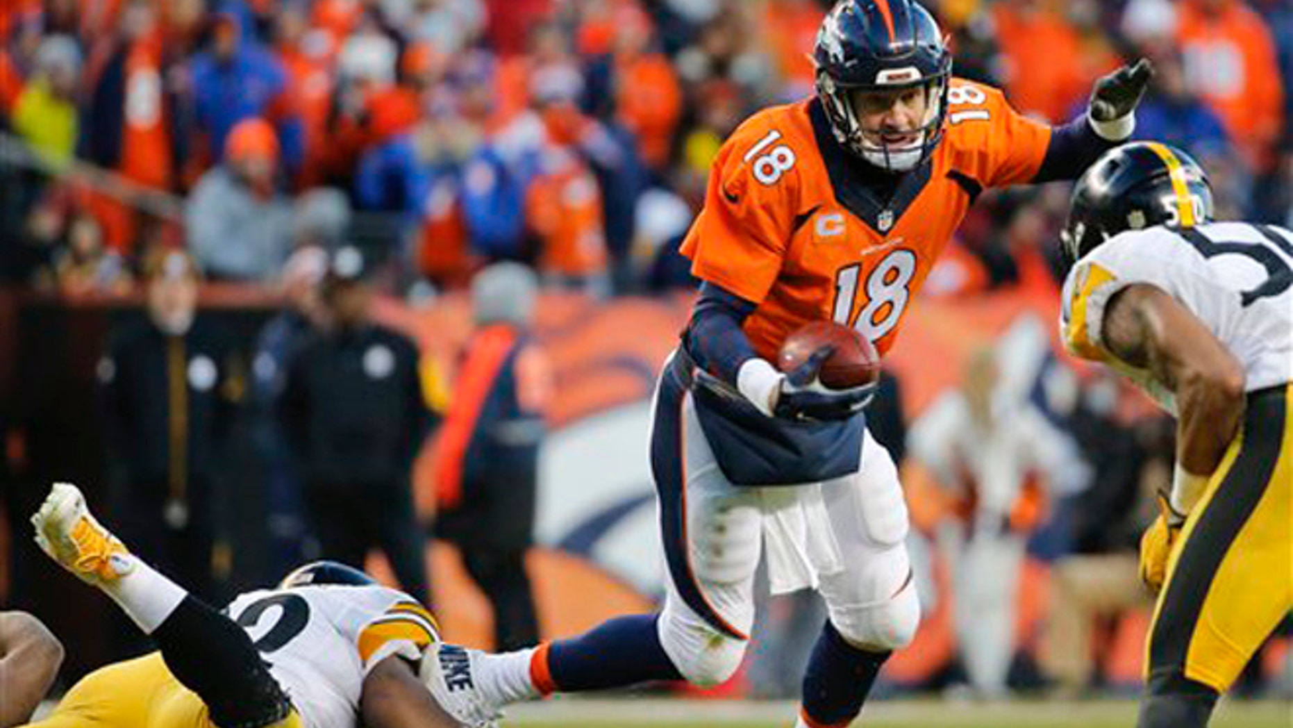 Denver Broncos quarterback Peyton Manning is sacked by Pittsburgh Steelers outside linebacker James Harrison, left, during the second half in an NFL football divisional playoff game, Sunday, Jan. 17, 2016, in Denver. (AP Photo/Jack Dempsey)