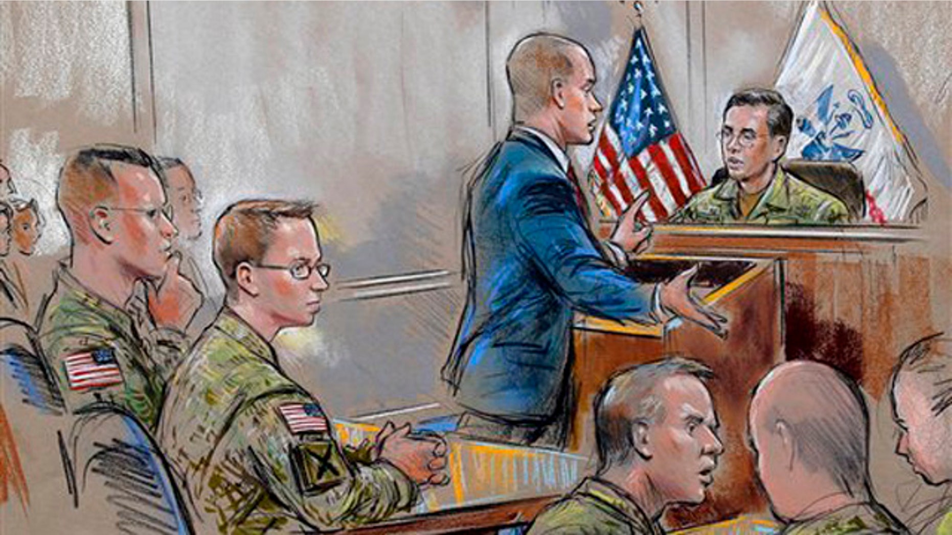 Dec. 16, 2011: In this courtroom sketch, Army Pfc. Bradley Manning, second from left, sits as his attorney, David E. Coombs, speaks during a military hearing in Fort Meade, Md.