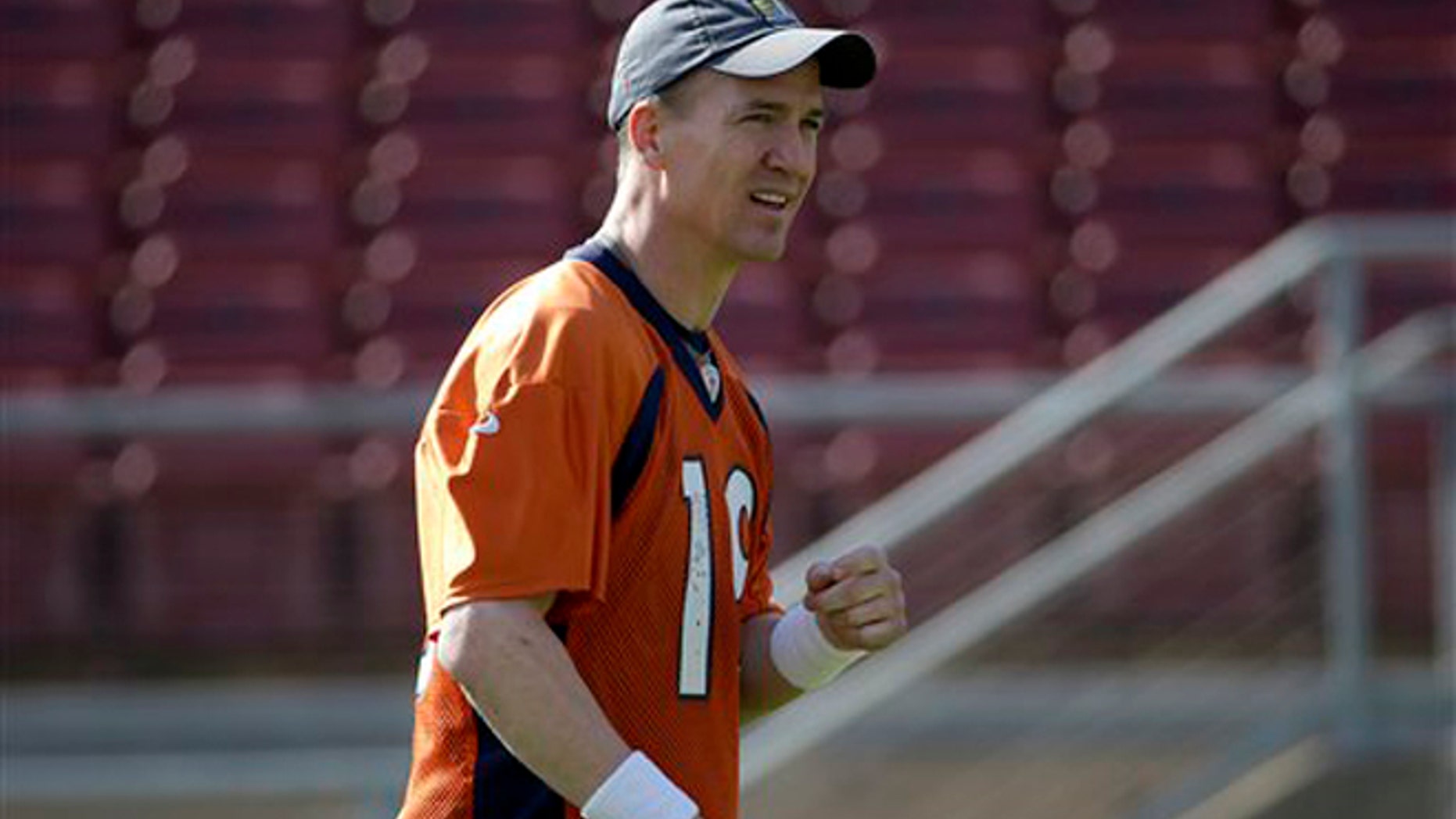 Denver Broncos quarterback Peyton Manning walks on the field during an NFL football practice in Stanford, Calif., Friday, Feb. 5, 2016. (AP Photo/Jeff Chiu)