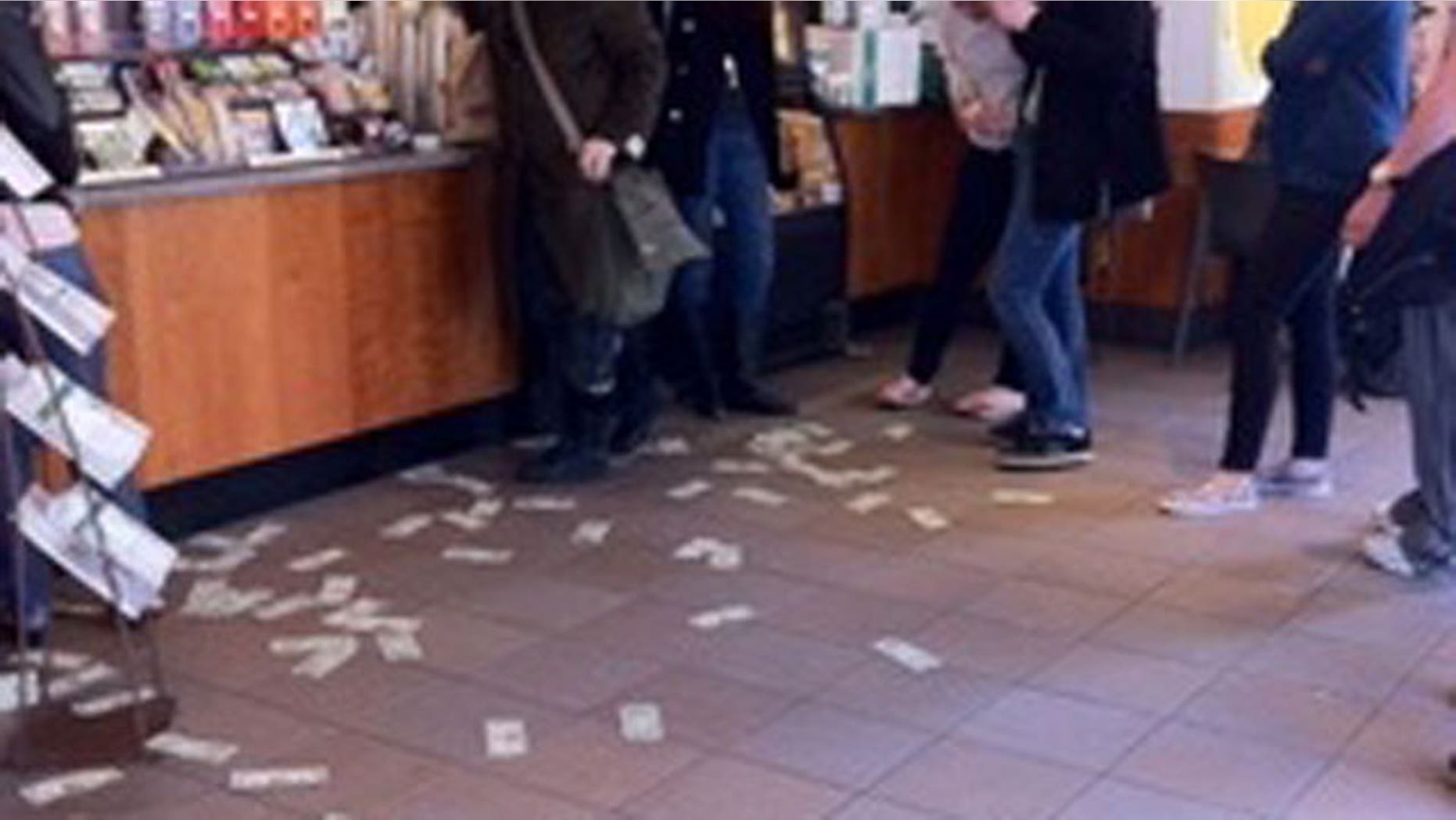 A mystery man walked into a local Starbucks in Boston and threw about $100 up in the air and walked out.