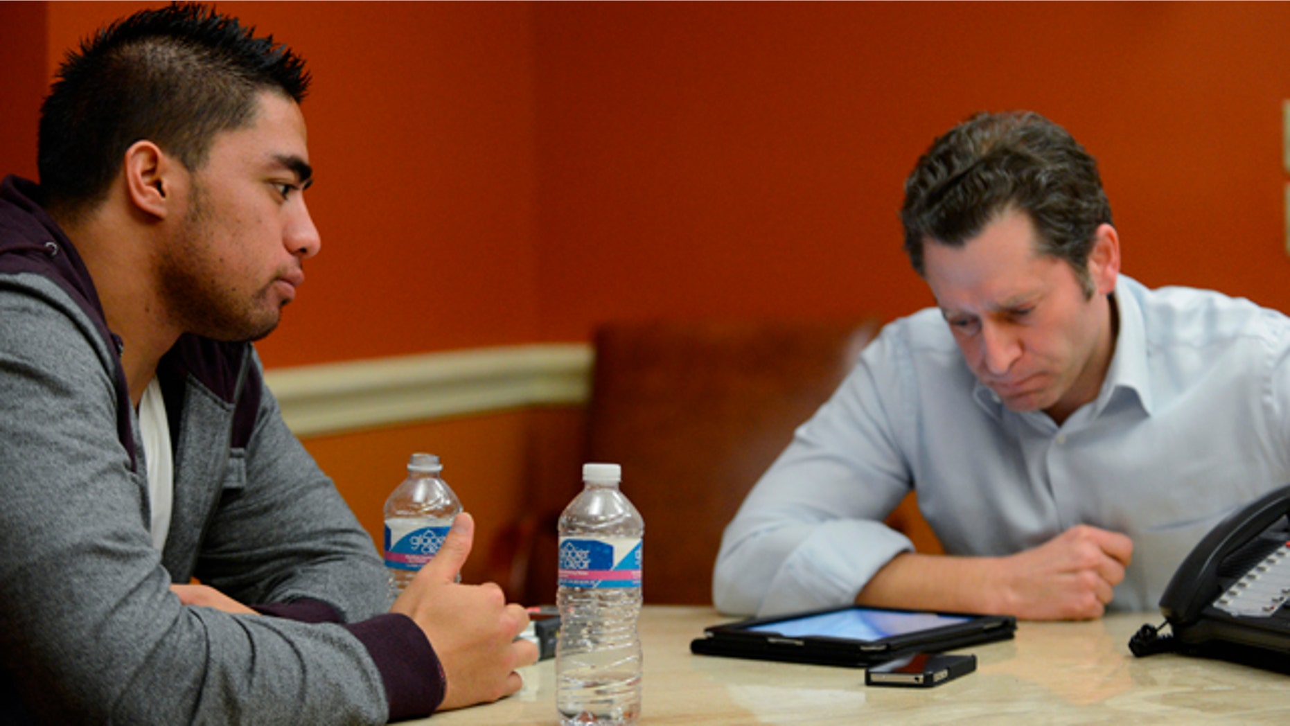 Jan. 18, 2013: In a photo provided by ESPN, Notre Dame linebacker Manti Te'o listens during an interview with ESPN's Jeremy Schaap, right, in Bradenton, Fla.