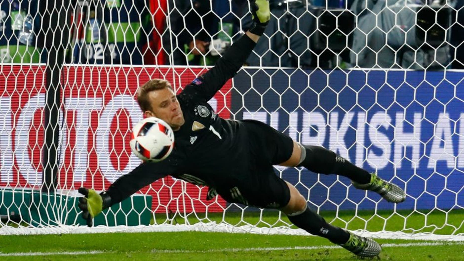 Football Soccer - Germany v Italy - EURO 2016 - Quarter Final - Stade de Bordeaux, Bordeaux, France - 2/7/16 Germany's Manuel Neuer makes a save during the penalty shootout REUTERS/Michael Dalder Livepic