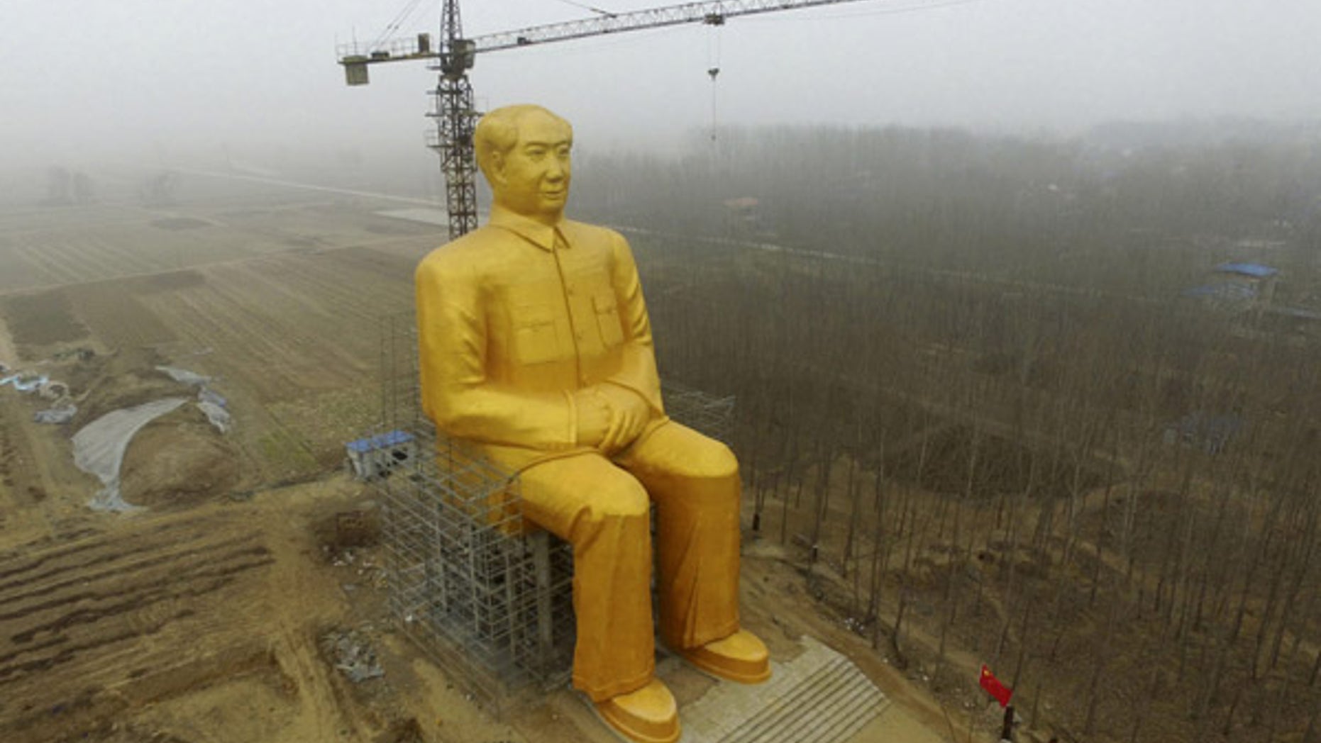 Jan. 4, 2016: A 120-foot tall gold-colored statue of former Chinese leader Mao Zedong is surrounded by farmland in Tongxu County in central China's Henan province. According to Chinese state media, businessmen and local villagers contributed nearly $460,000 to build the cement statue.
