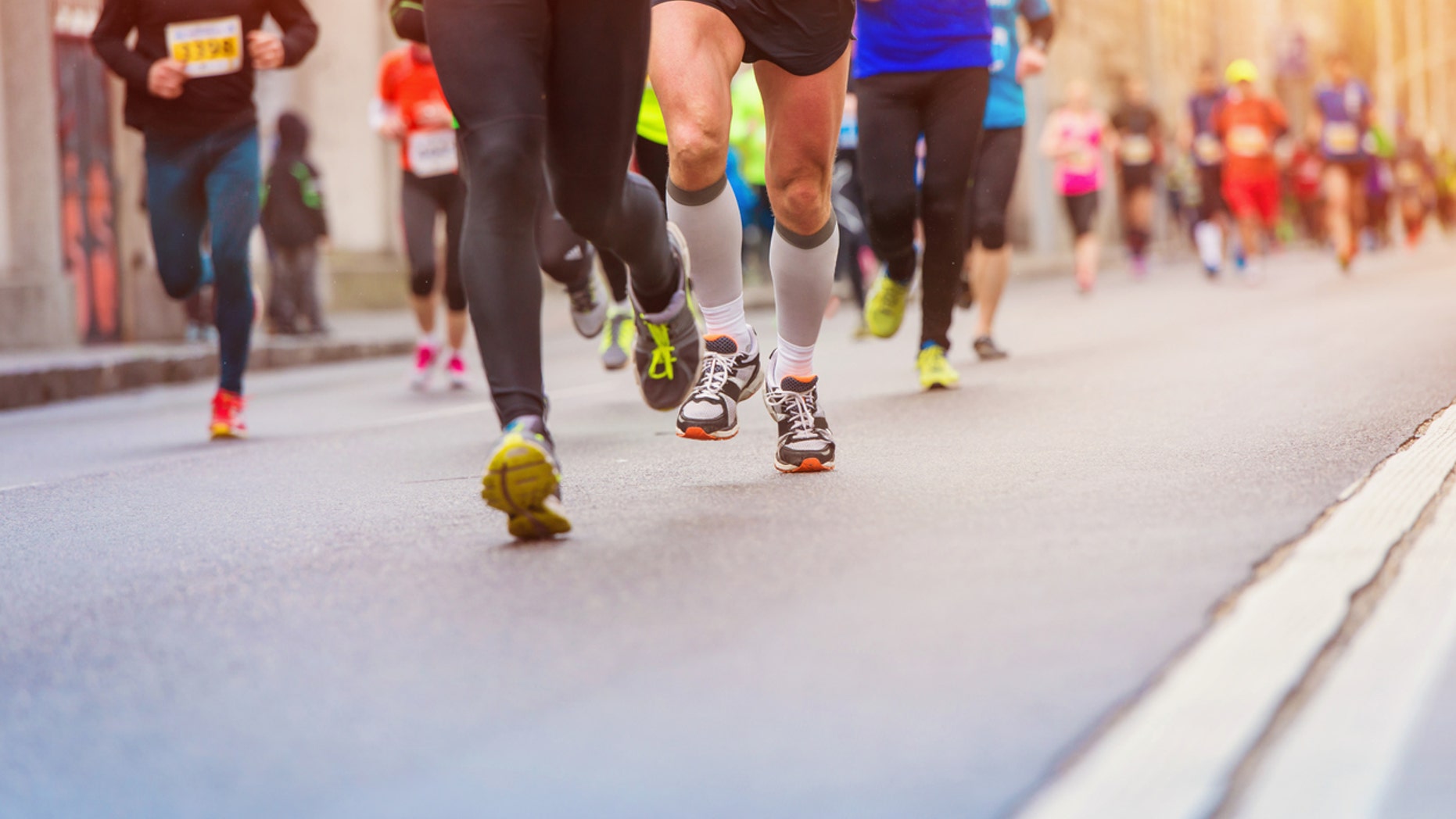 Unrecognizable young runners at the city race