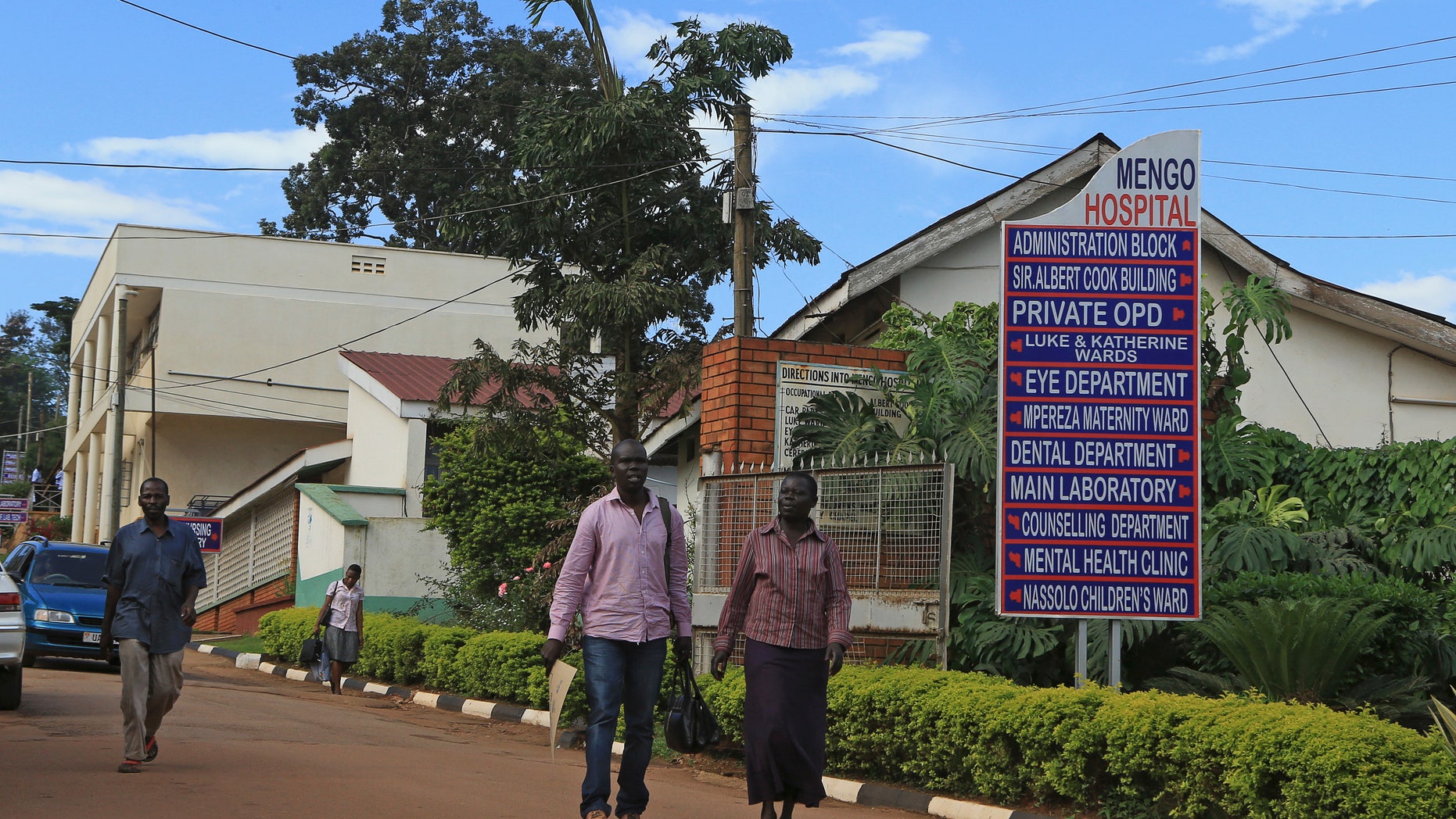 People walk in Mengo Hospital, where an employee died from the Ebola-like Marburg virus, in the Uganda capital Kampala October 6, 2014. REUTERS/James Akena