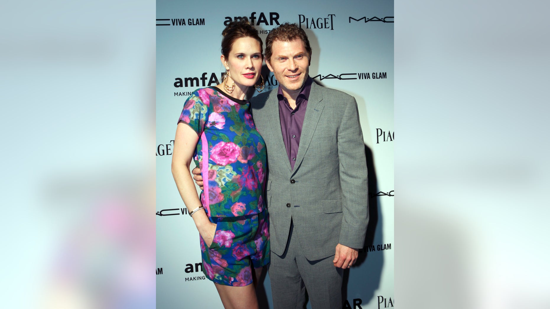 December 6, 2012. Actress Stephanie March and her husband, chef Bobby Flay, attend the amfAR Inspiration Miami Beach Party at Soho Beach House in Miami Beach, Florida.